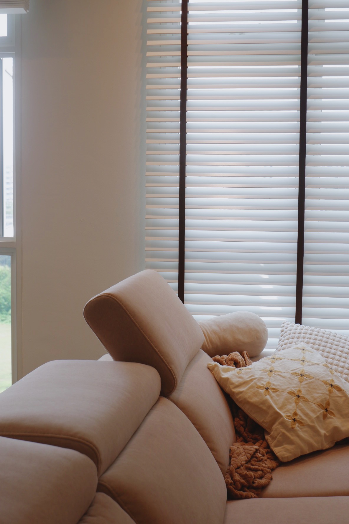 Our Simple Living Room: It's so-fa so good - Cream-colored sofa, soft cushions, natural light streaming through blinds, cozy
