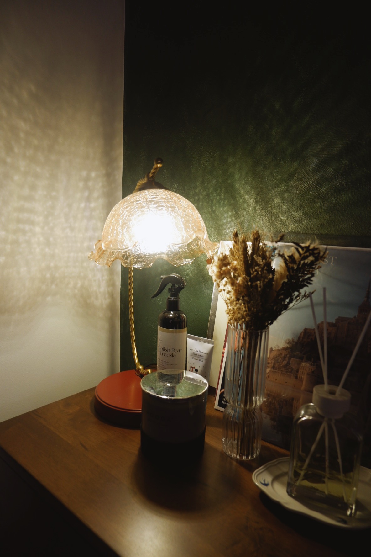 Our Simple Living Room: It's so-fa so good - Glowing lamp with intricate design, soft warm light, textured wall behind