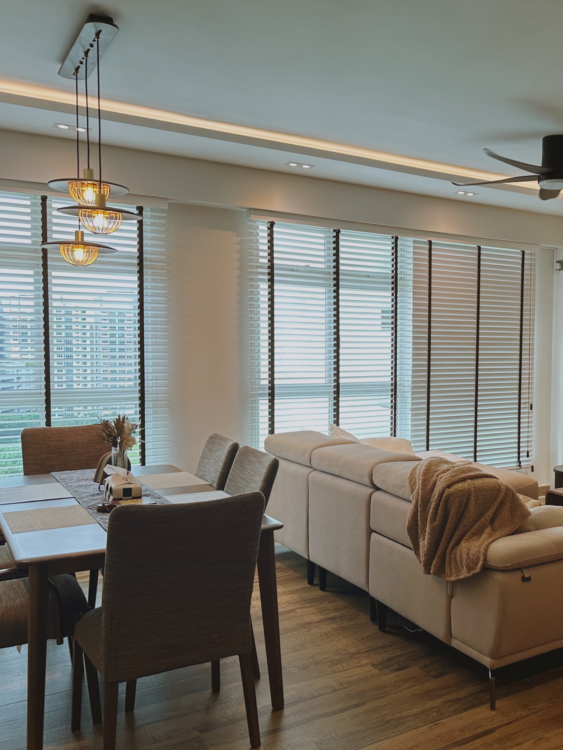 Our Simple Living Room: It's so-fa so good - Modern dining room with beige sofa, wooden dining table, stylish pendant lights