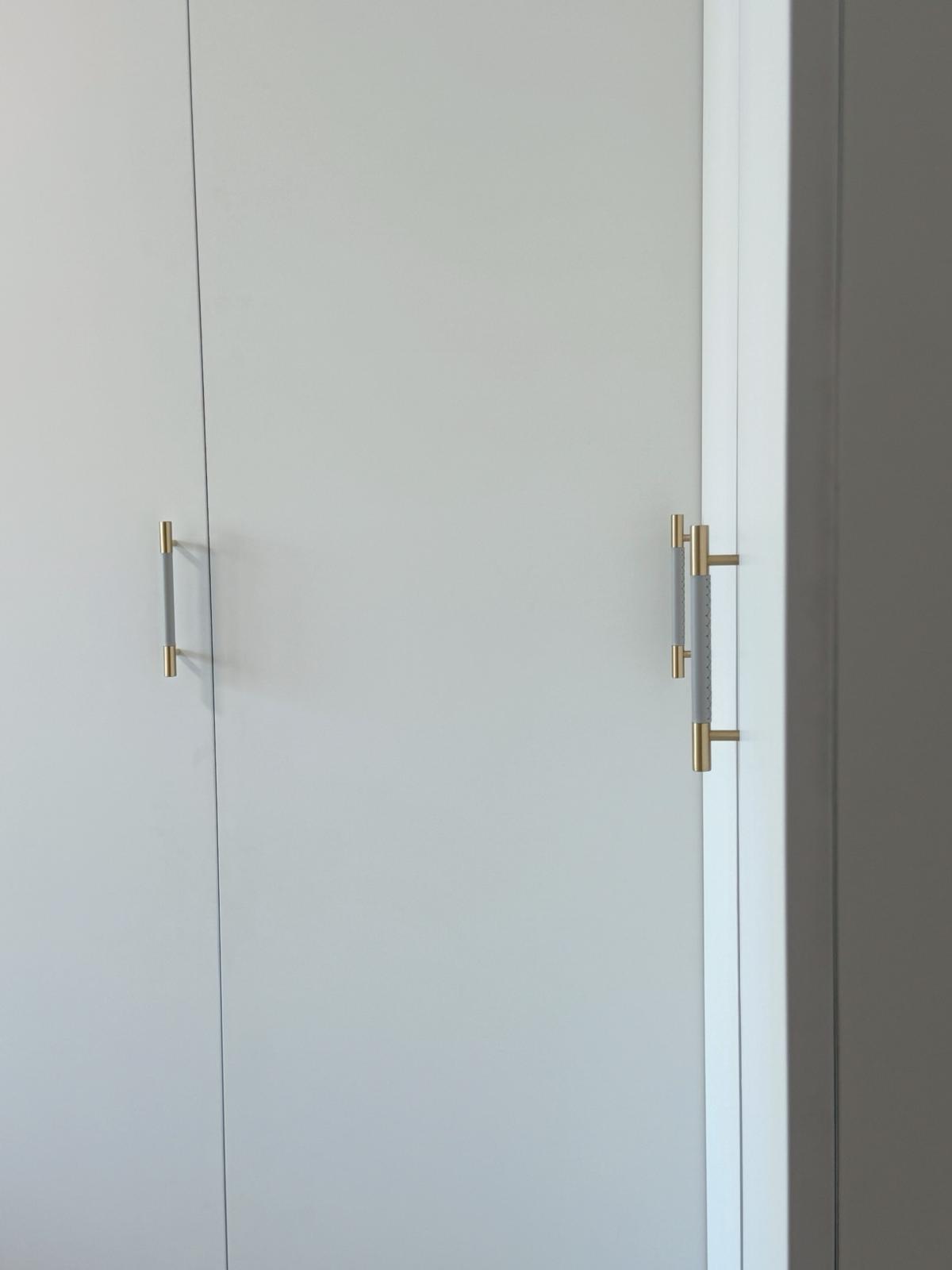 Our master bedroom: Clean and simple space to melt away stresses - White door with gold handles, minimalist design, sleek