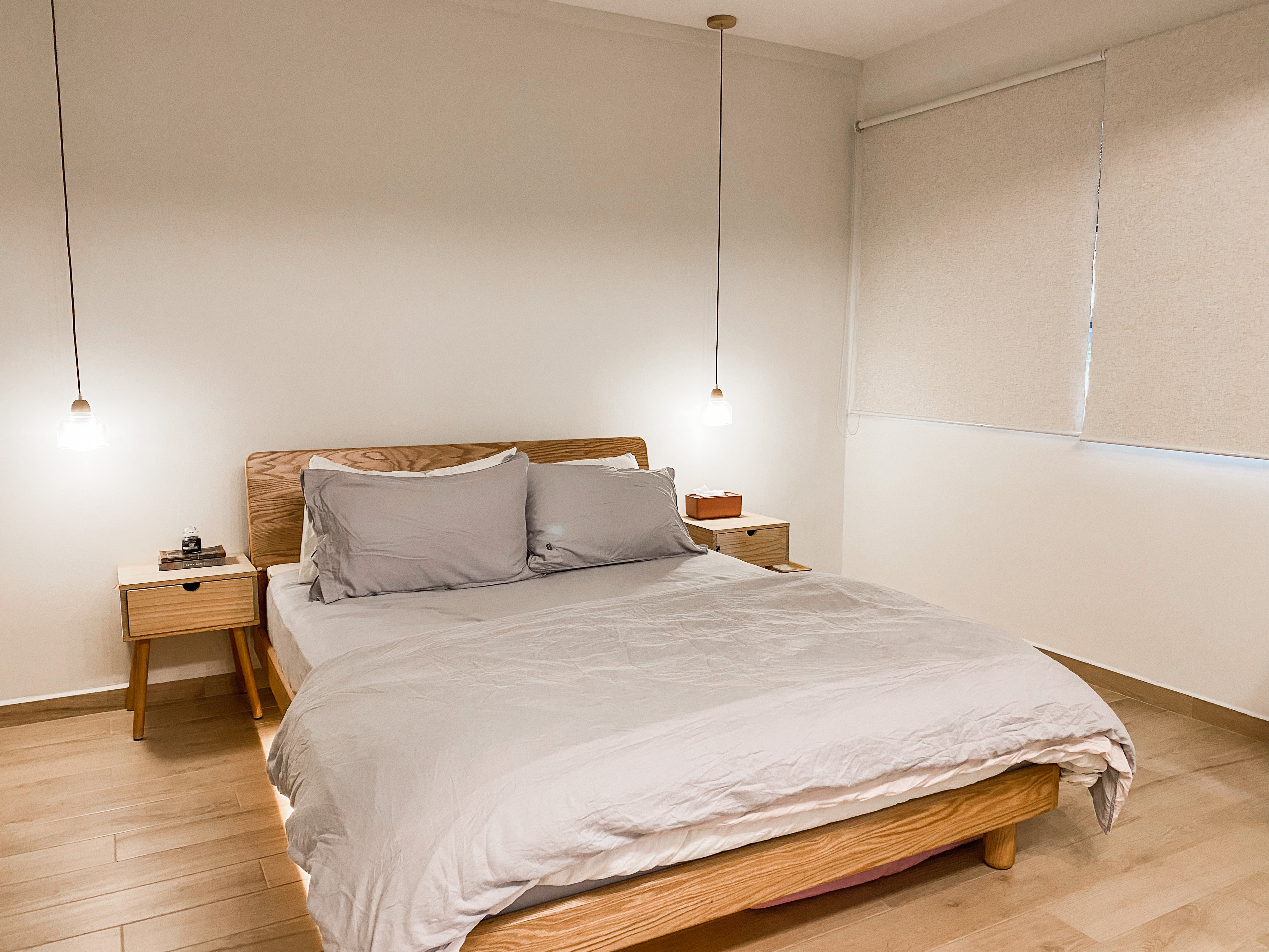 Warm fuzzy cosy nook to wind down - Wooden nightstands, beige curtains, minimalist design, soft lighting, wooden headboard