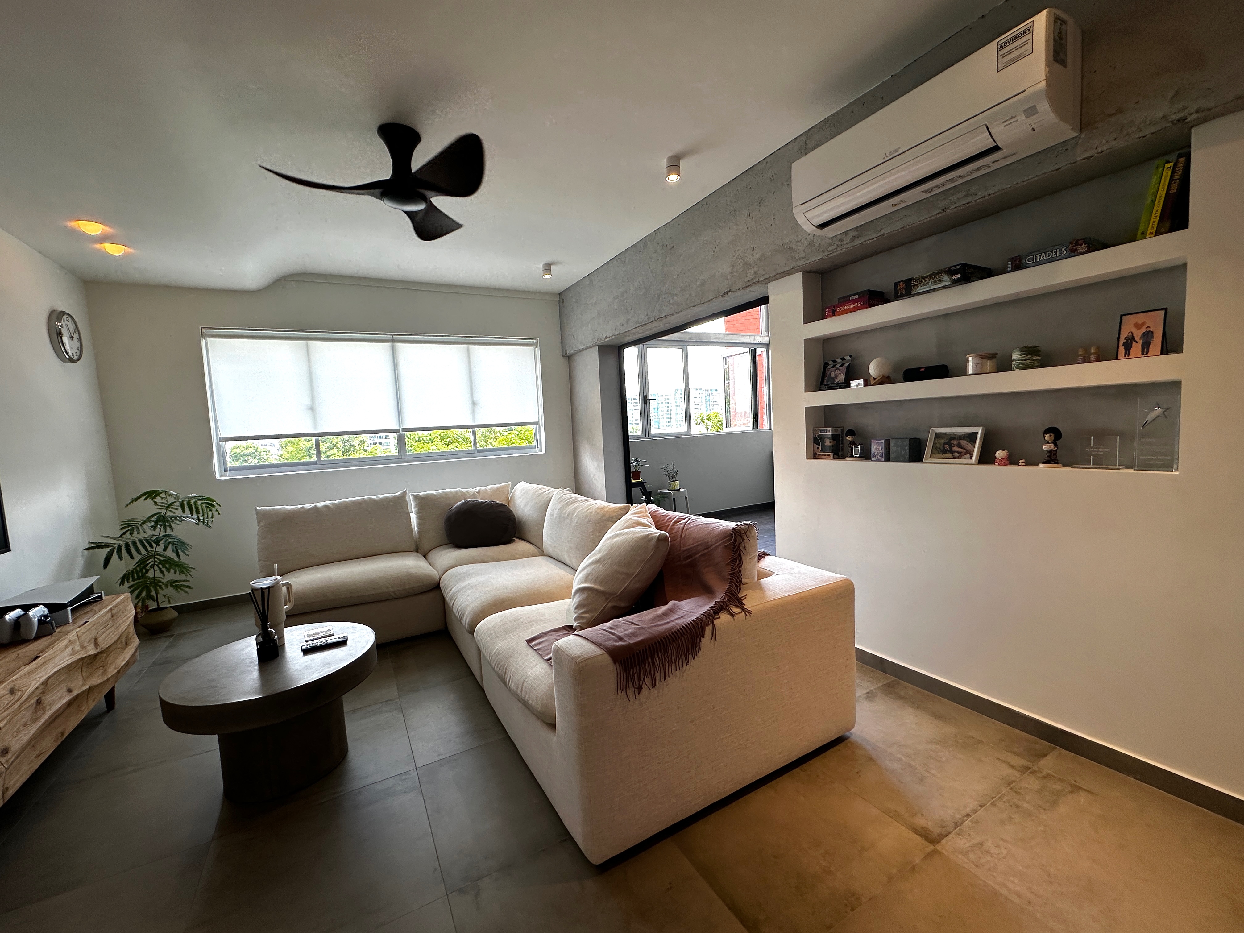 Living Room: Our Oasis with no built-in! - Modern living room with beige sectional sofa, round coffee table, large window