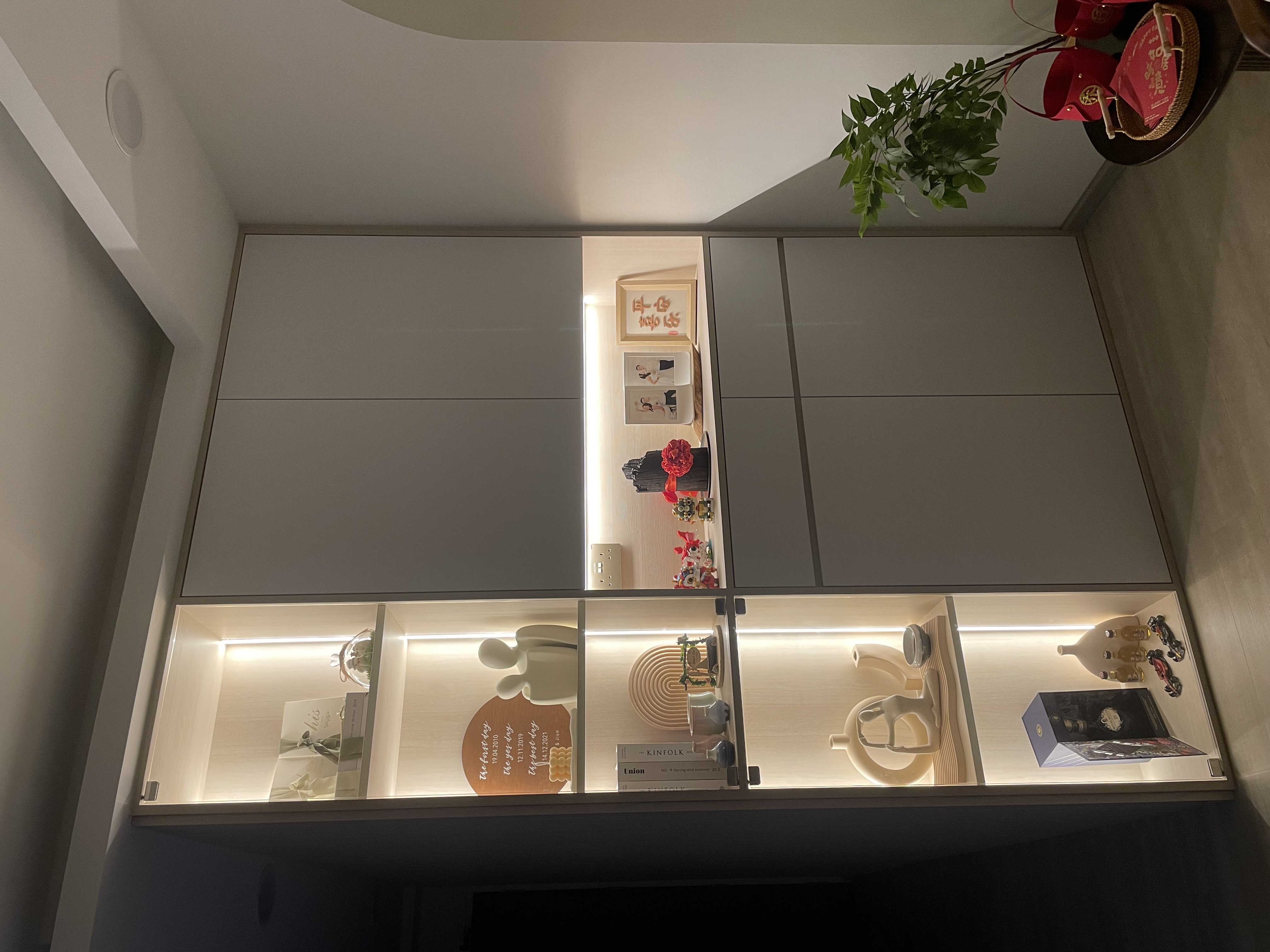 Living Room: Embracing Nordic Warmth with Wooden and Rattan Accents - Modern minimalist cabinet, illuminated shelves