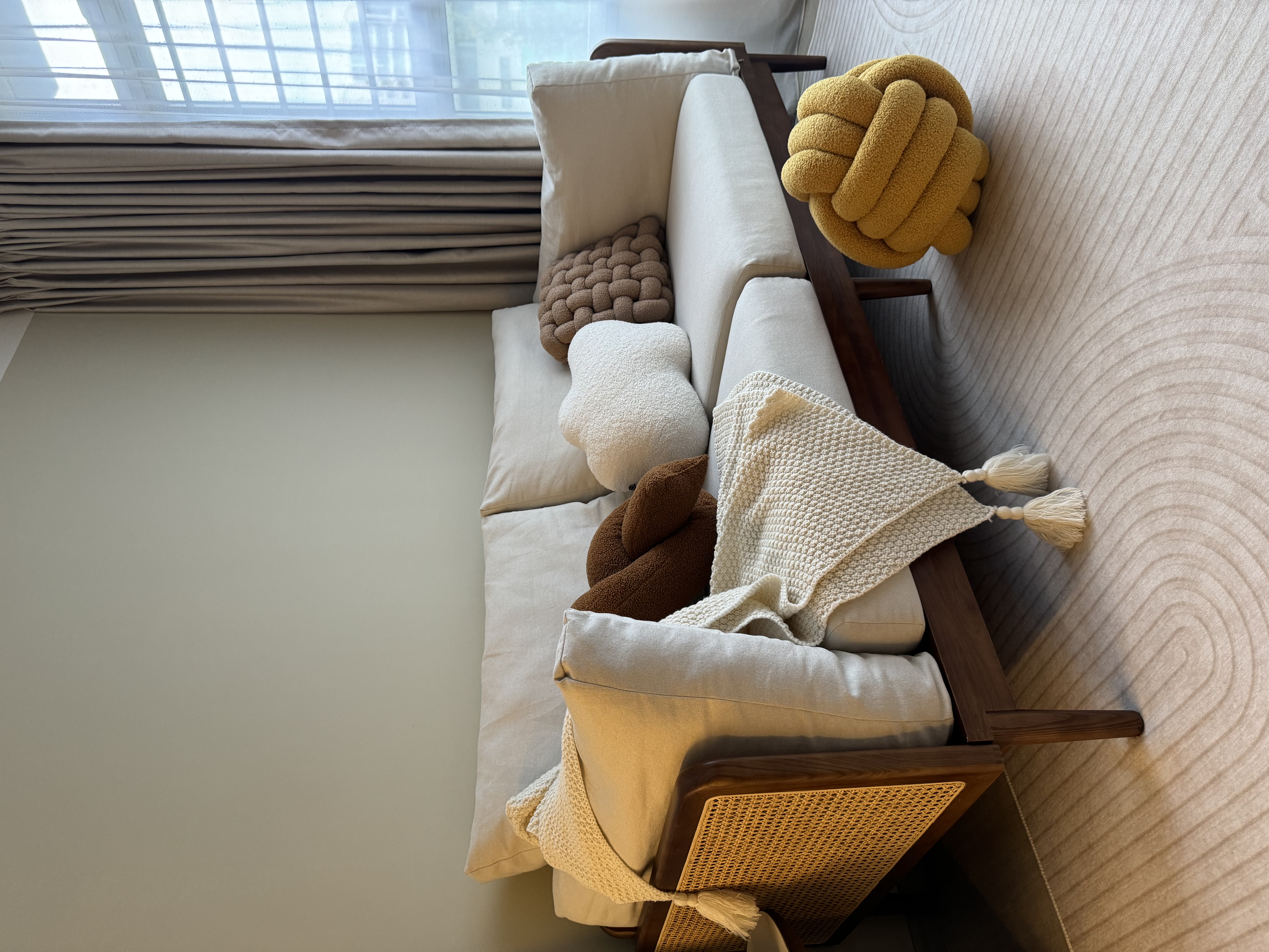 Living-Room:-Embracing-Nordic-Warmth-with-Wooden-and-Rattan-Accents