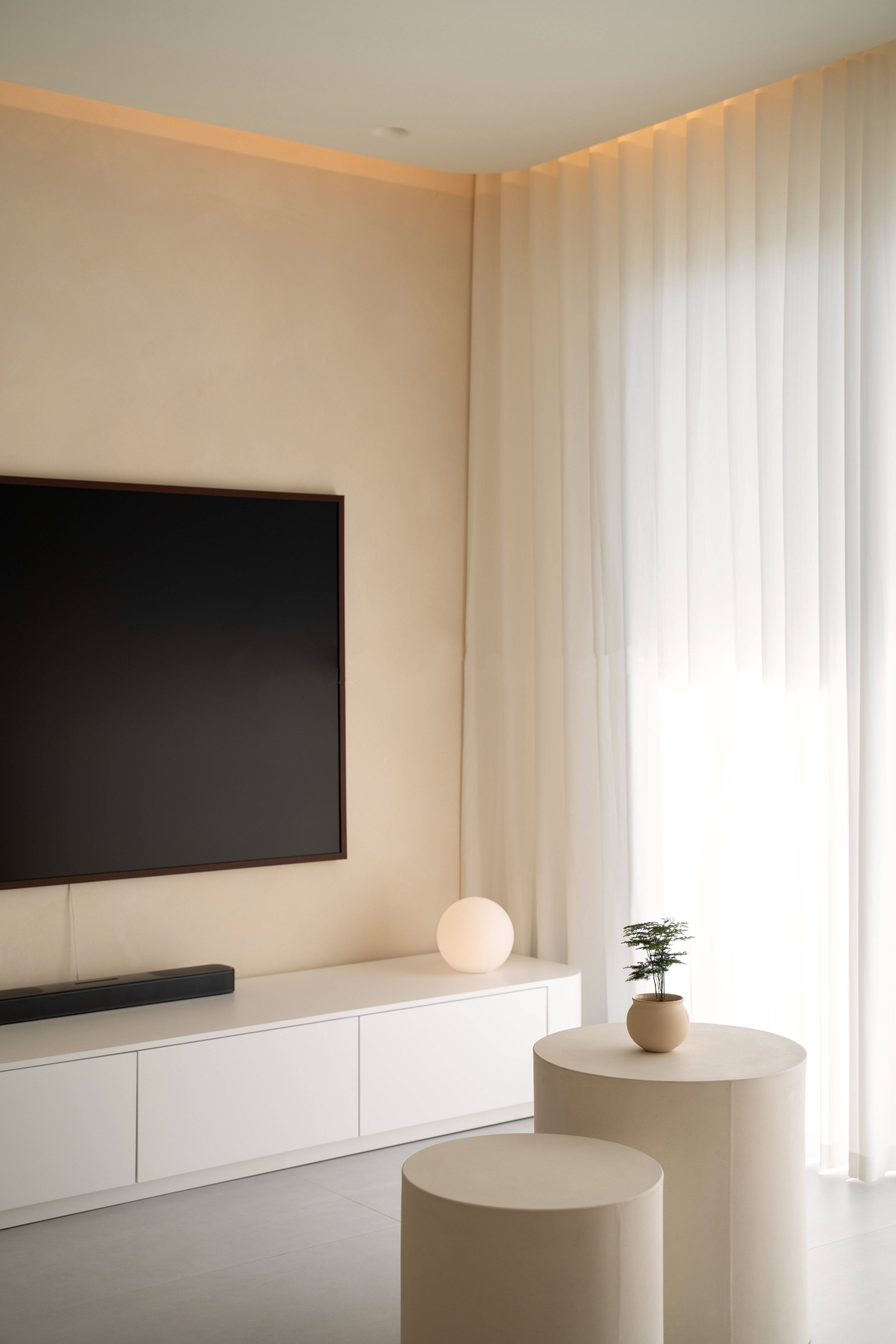 Our Creamy Home: A Home Design Diary  - Modern minimalist living room, neutral color palette, large flat-screen TV, white