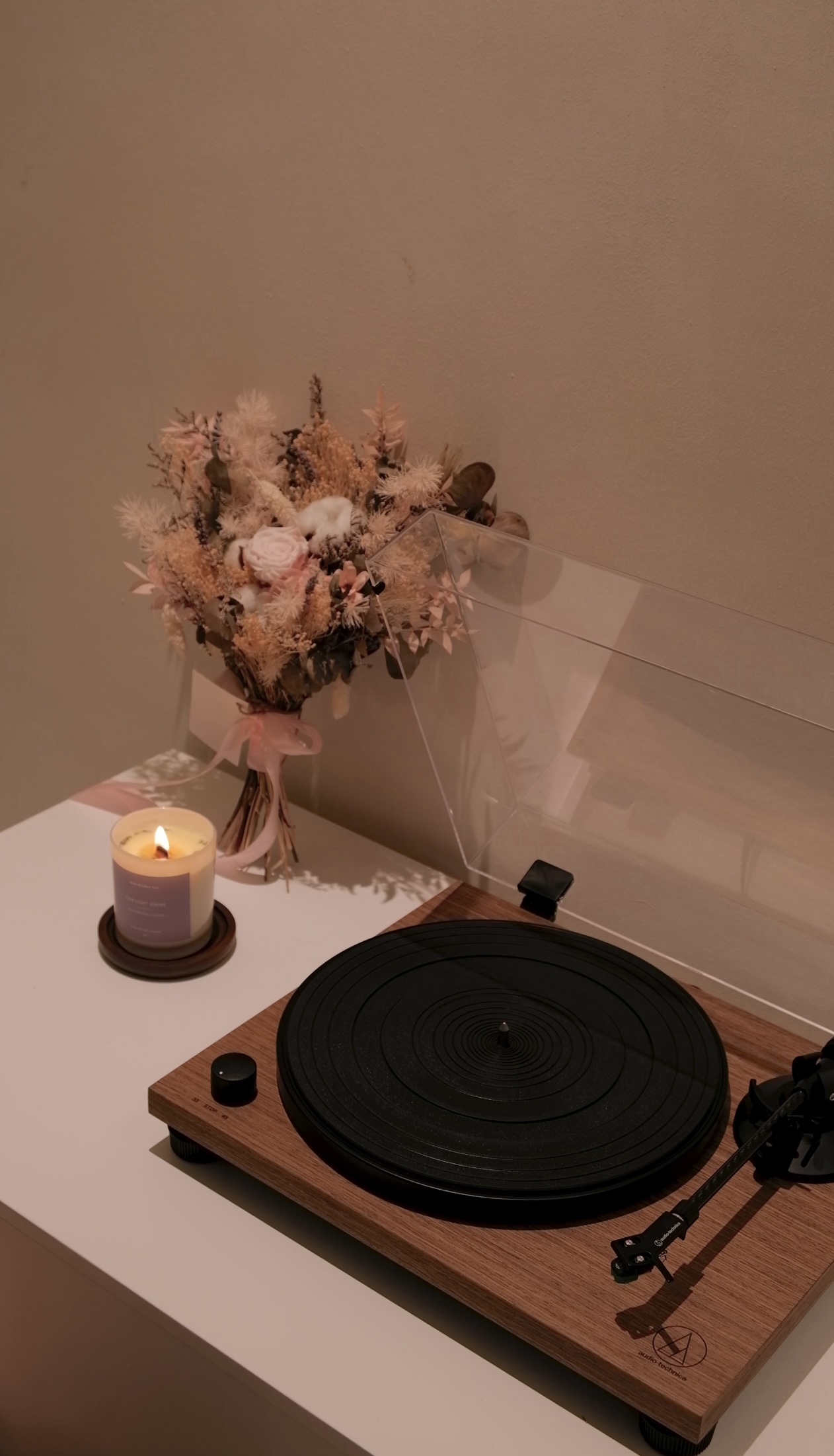 Our Creamy Home: A Home Design Diary  - vintage vinyl record player, wooden turntable, black needle, soft candle, pastel