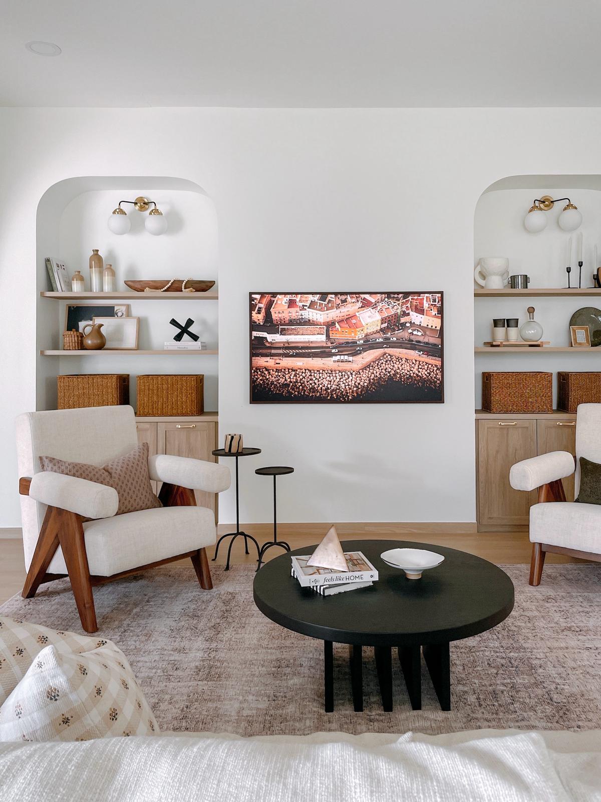 Our bright and airy Minimalist living room  - modern living room, cozy seating, beige armchairs, wooden legs, abstract art