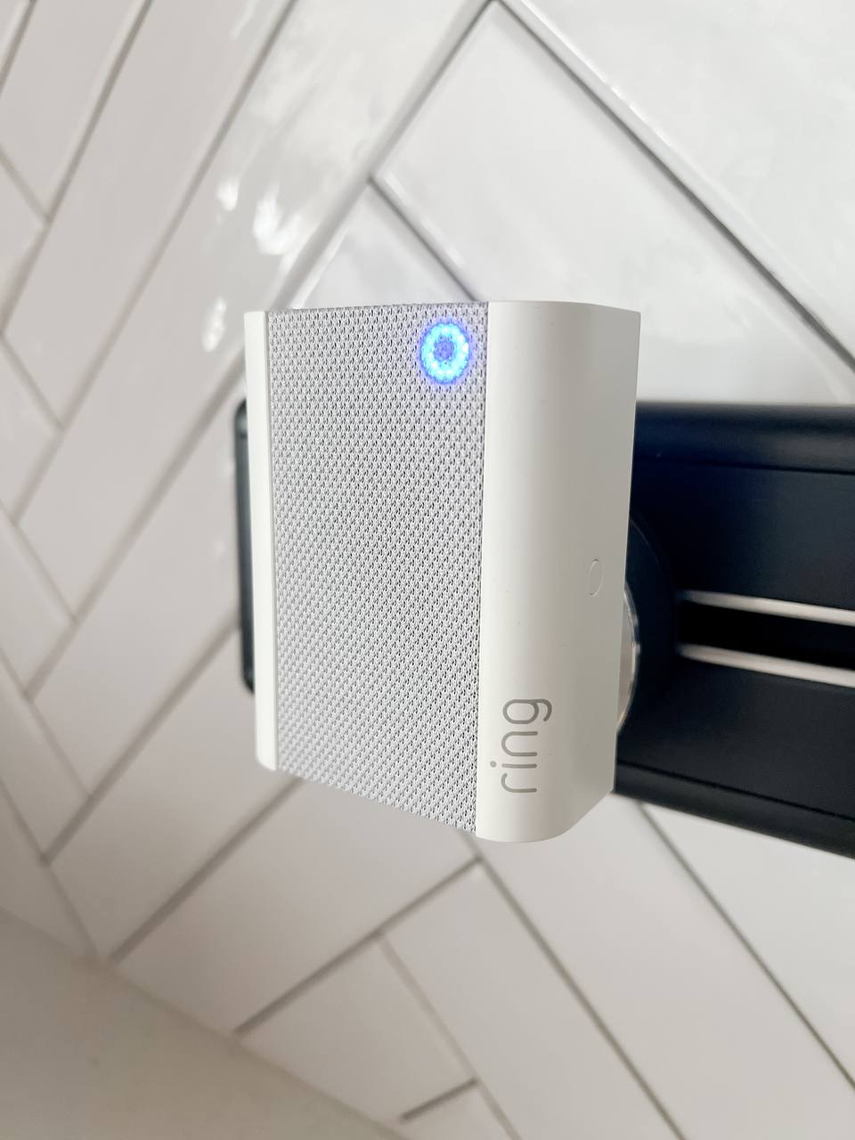 Essential Home Investments: Top 4 Must-Have Purchases - White ring speaker, sleek design, blue LED light, modern aesthetic