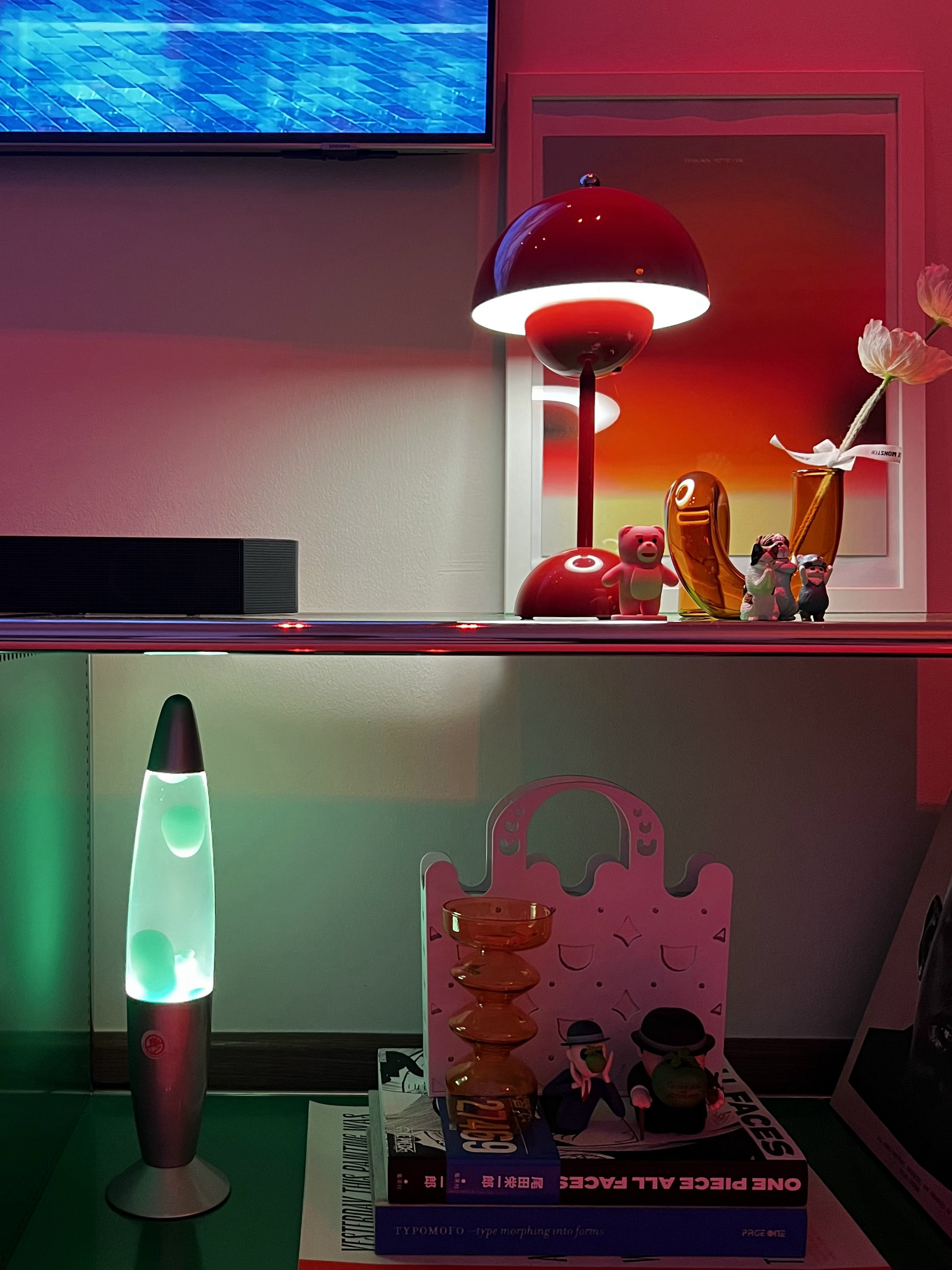 A Playground for Conversations  - Red and green LED desk lamp, modern minimalist decor, abstract art background, pink and