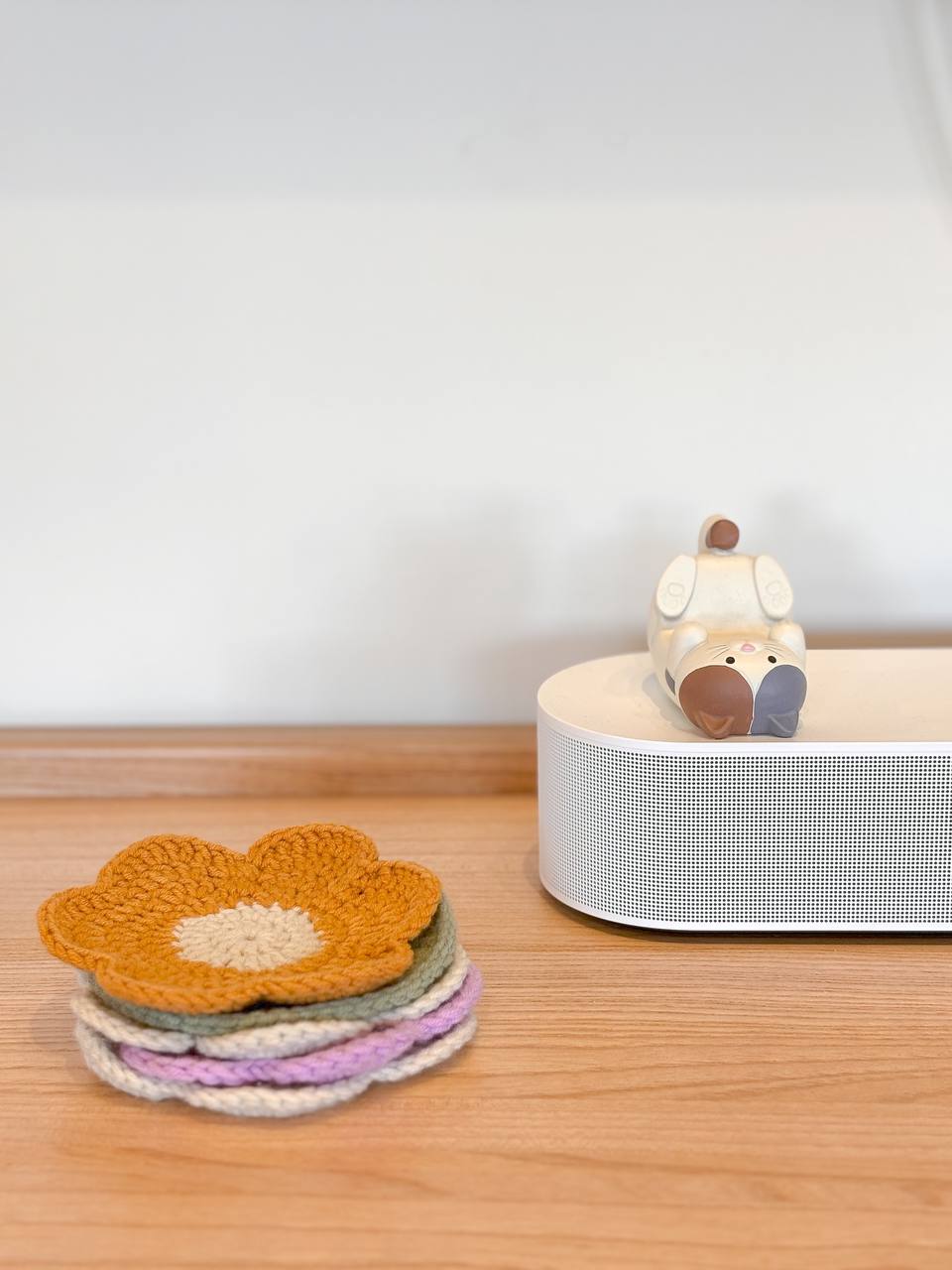 Our Living Room and It's Colours - Crocheted flower, cozy setting, wooden table, soft lighting, pastel colors, handmade