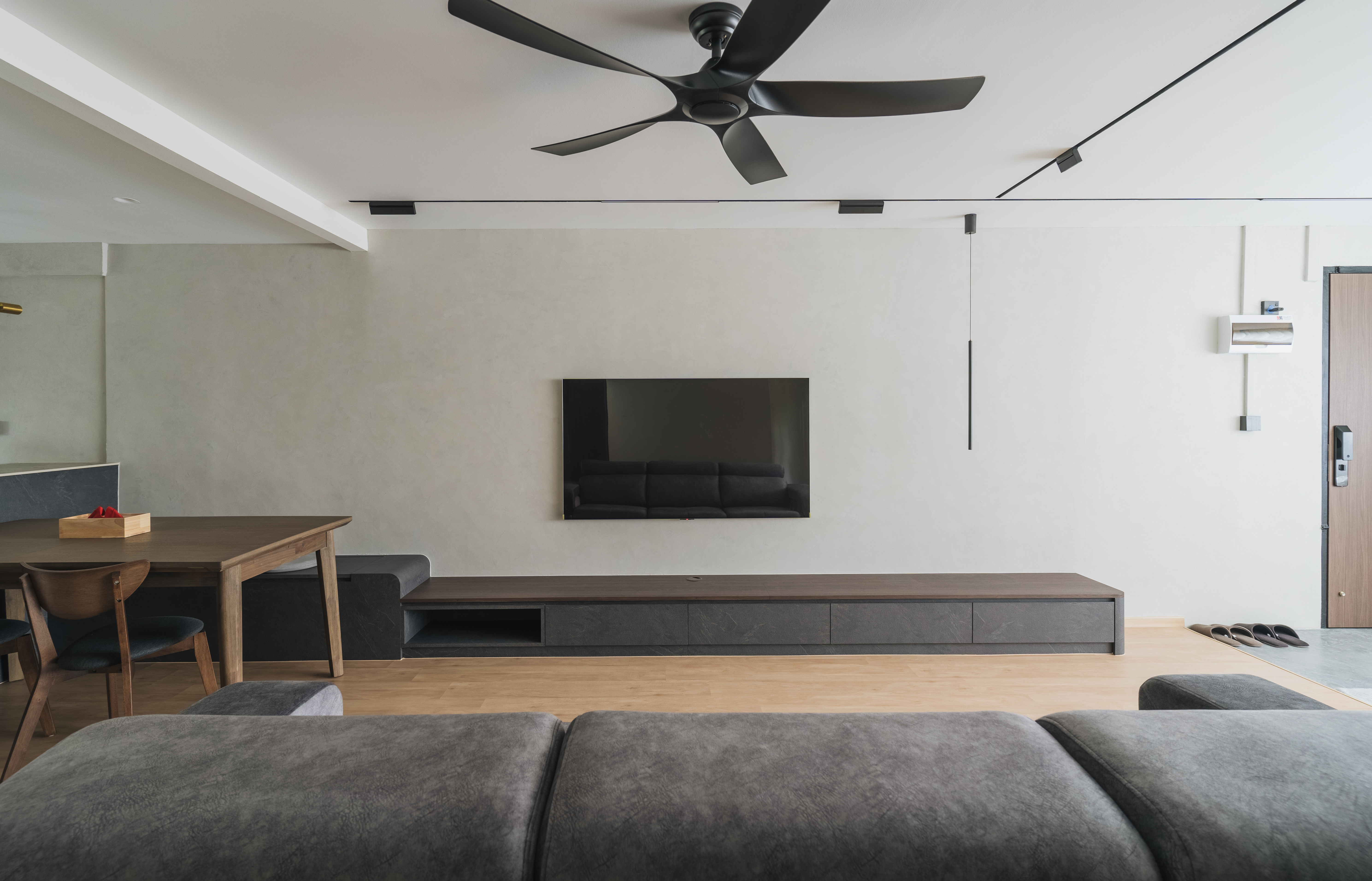 Welcome to our Serangoon Japandi-inspired 4-room haven! - Modern minimalist living room, sleek ceiling fan, light gray walls