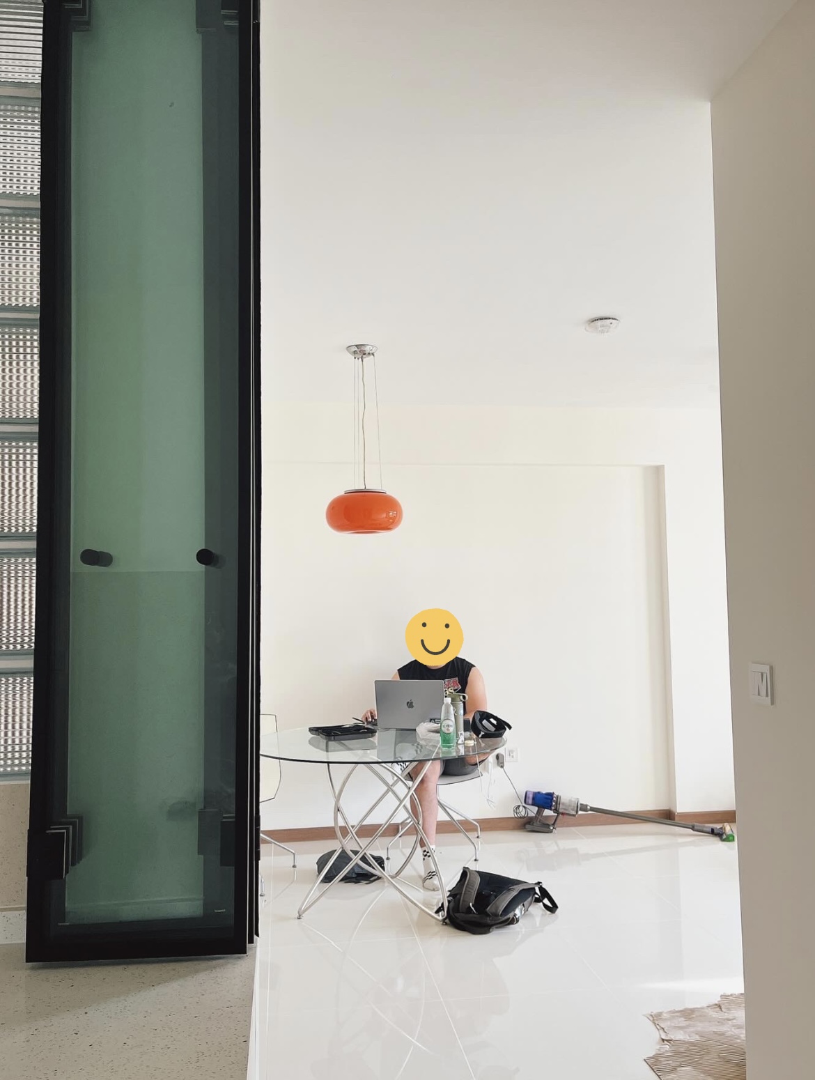 Our tips to help save costs for your renovation - Modern minimalist interior, glass partition, sleek black frame, orange