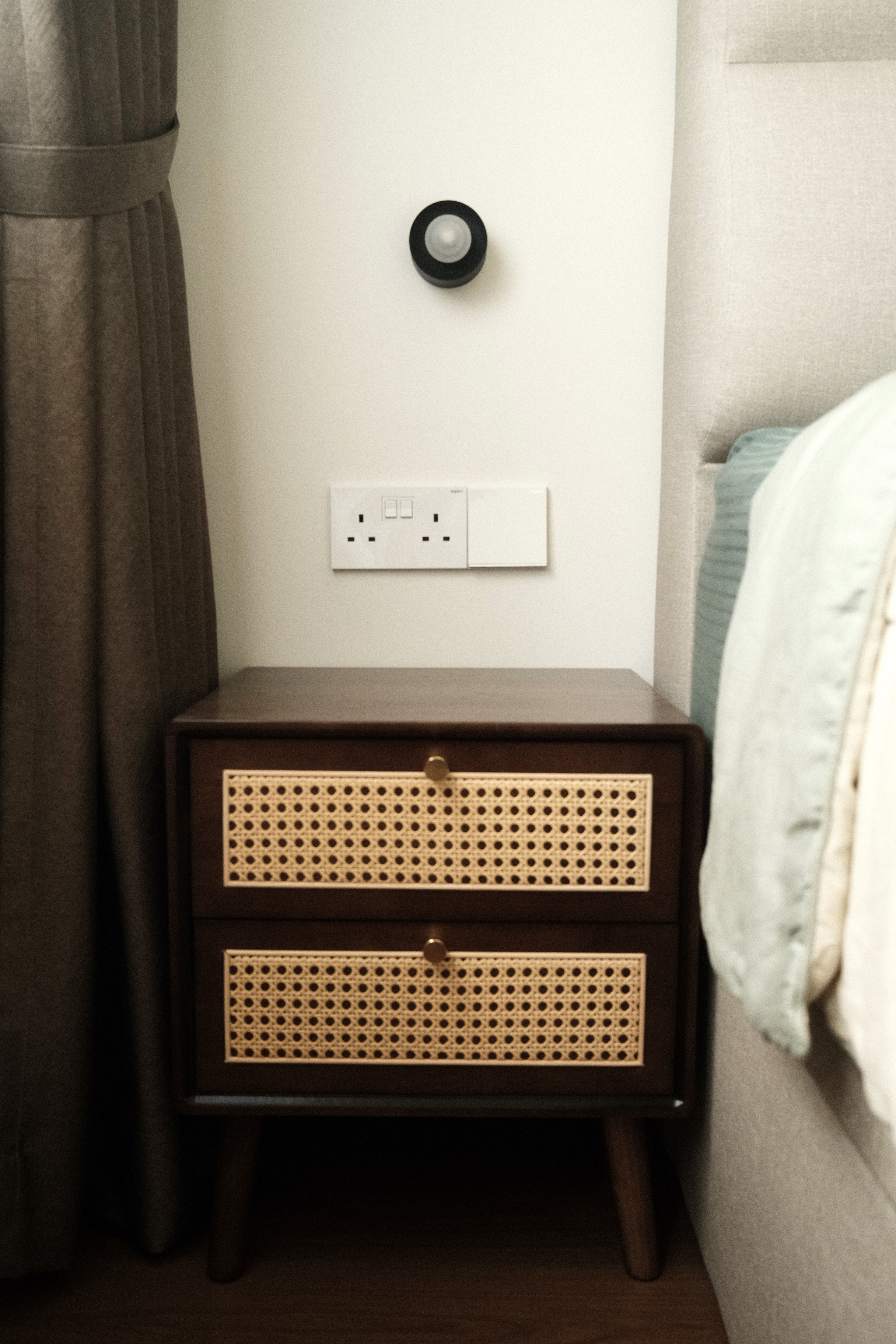 Our serene bedroom with minimal carpentry - Wooden nightstand with woven front panel, dark brown finish, two drawers, brass