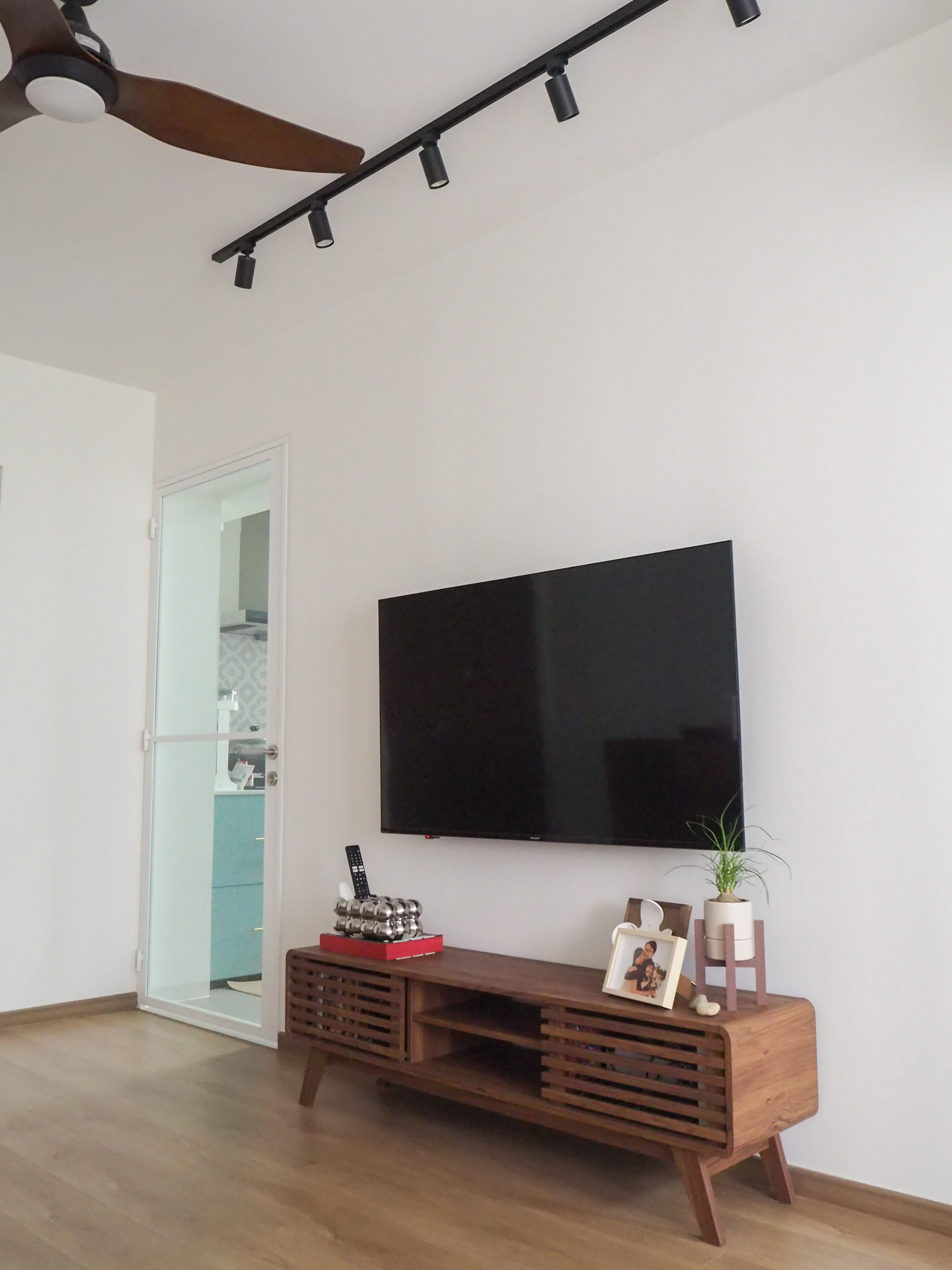 Our living room with no built-in carpentry  - Modern minimalist living room, sleek ceiling fan, black track lighting, wooden