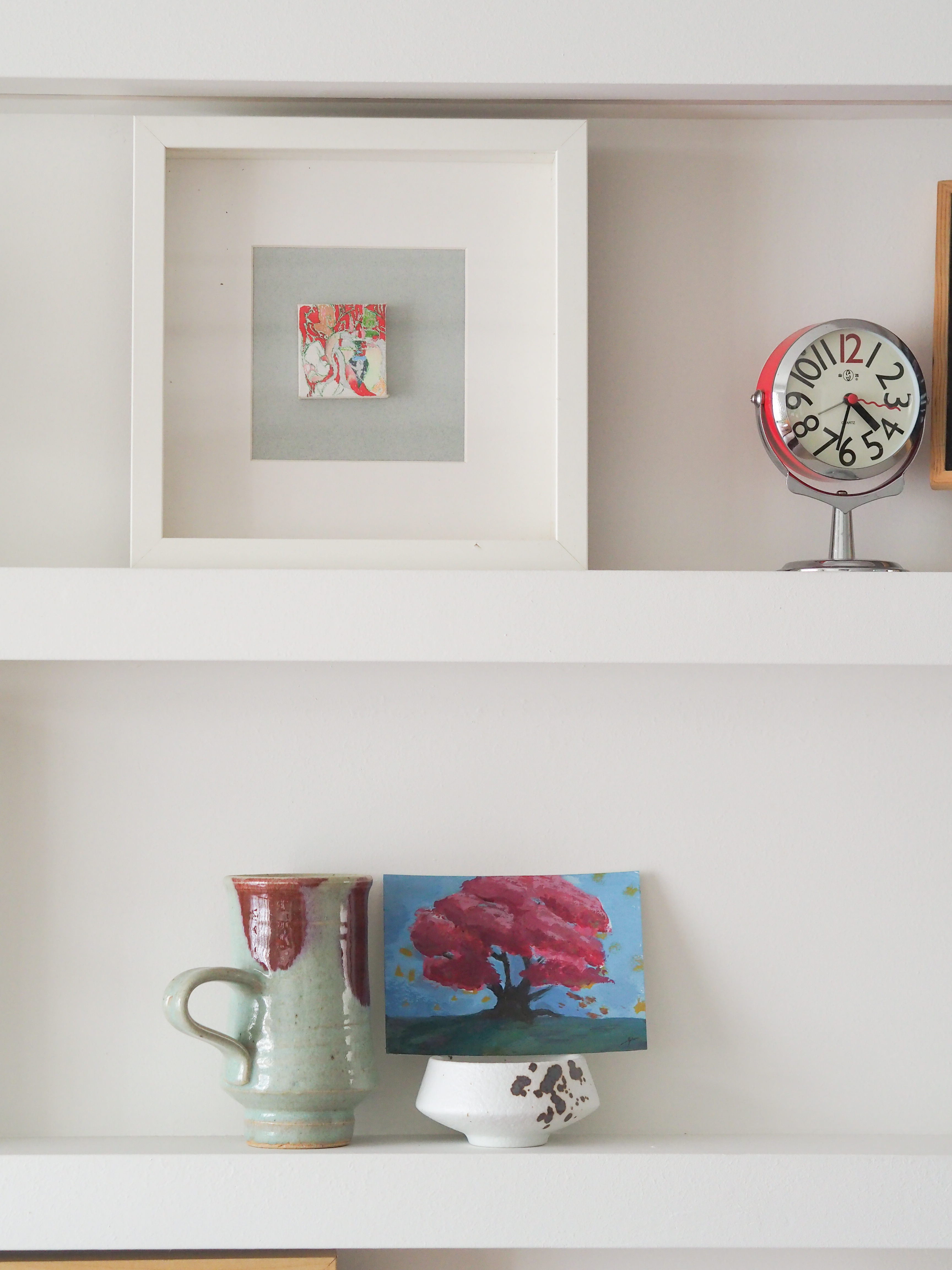 Our living room with no built-in carpentry  - White shelf, minimalist decor, colorful artwork, framed piece, clock, abstract