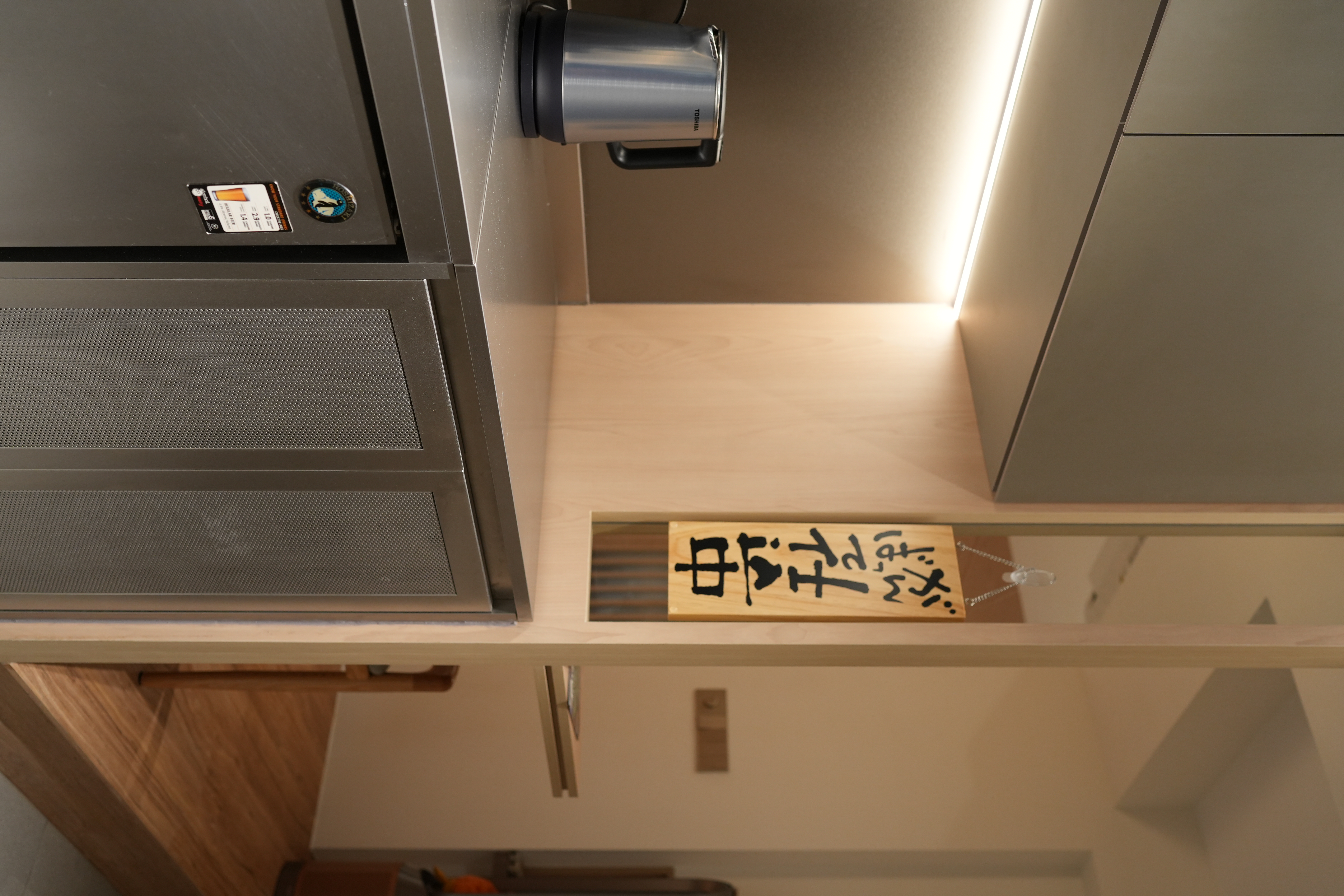 A Chef's Kitchen: Stainless Steel & Japanese Monotonal Design - microwave, kitchen cabinet, wooden shelf, Japanese