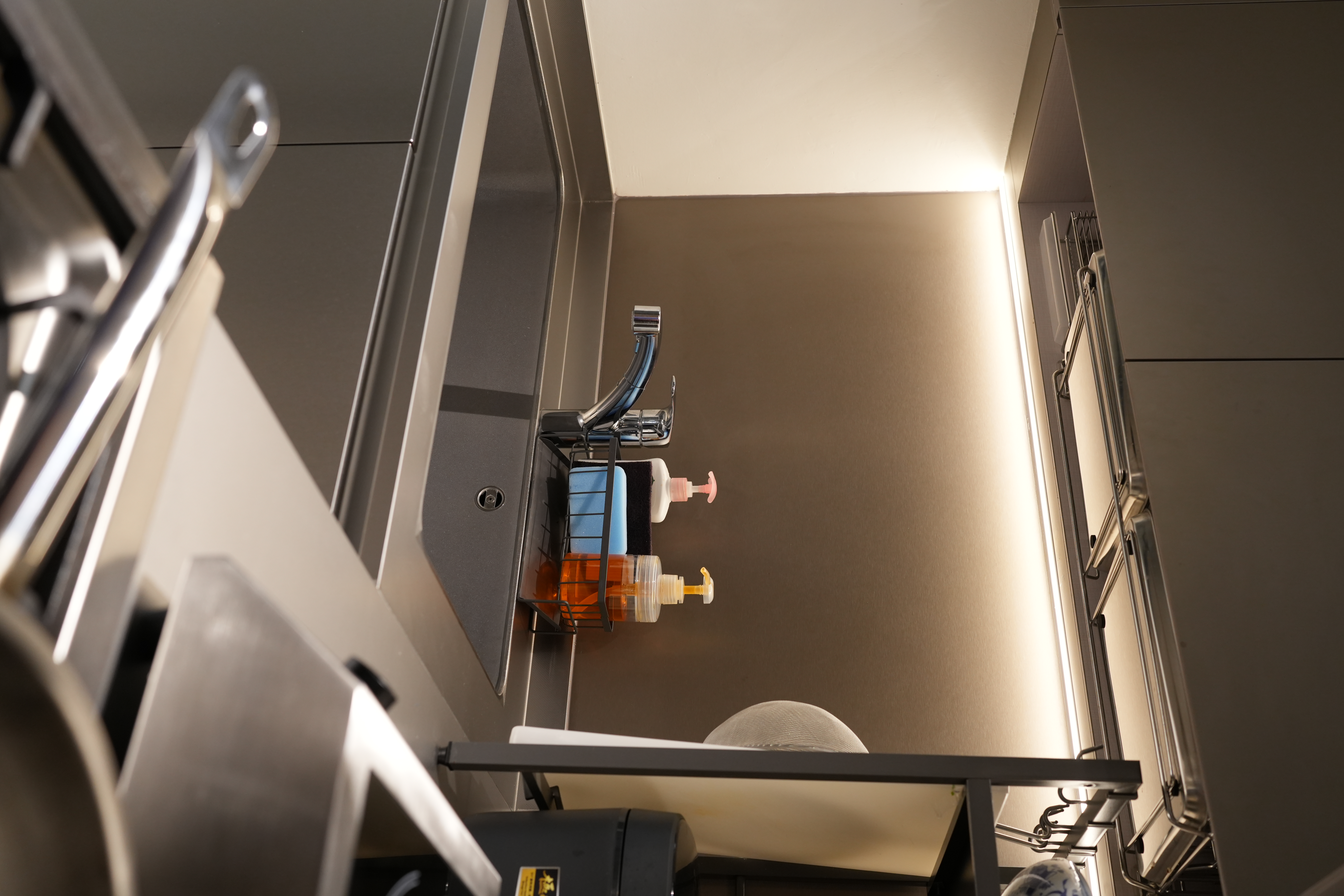 A Chef's Kitchen: Stainless Steel & Japanese Monotonal Design - Modern bathroom sink, sleek faucet, illuminated corner