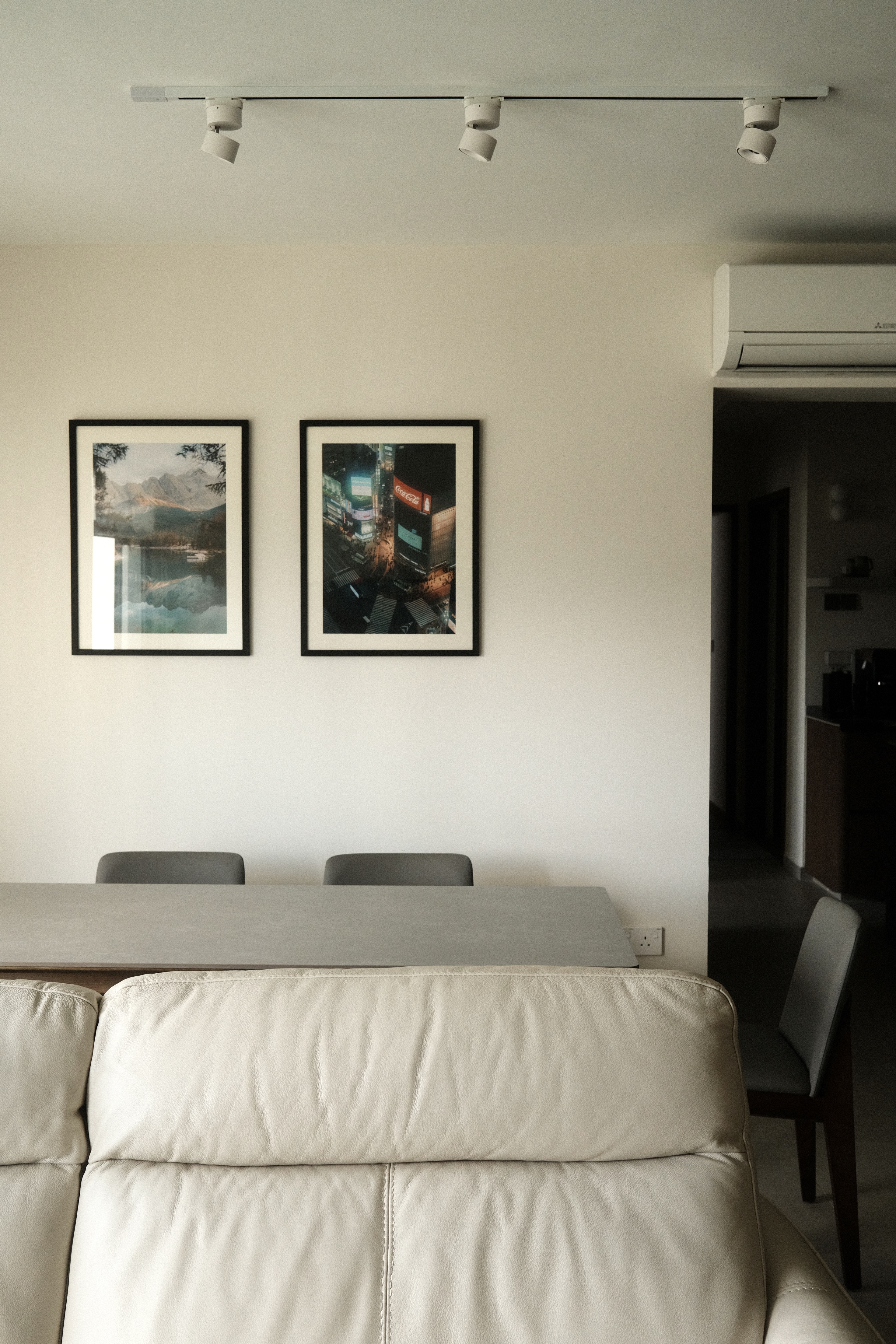 Japandi Living Room with Clean, Neutral Colours - Modern minimalist dining room, neutral color palette, two framed pictures