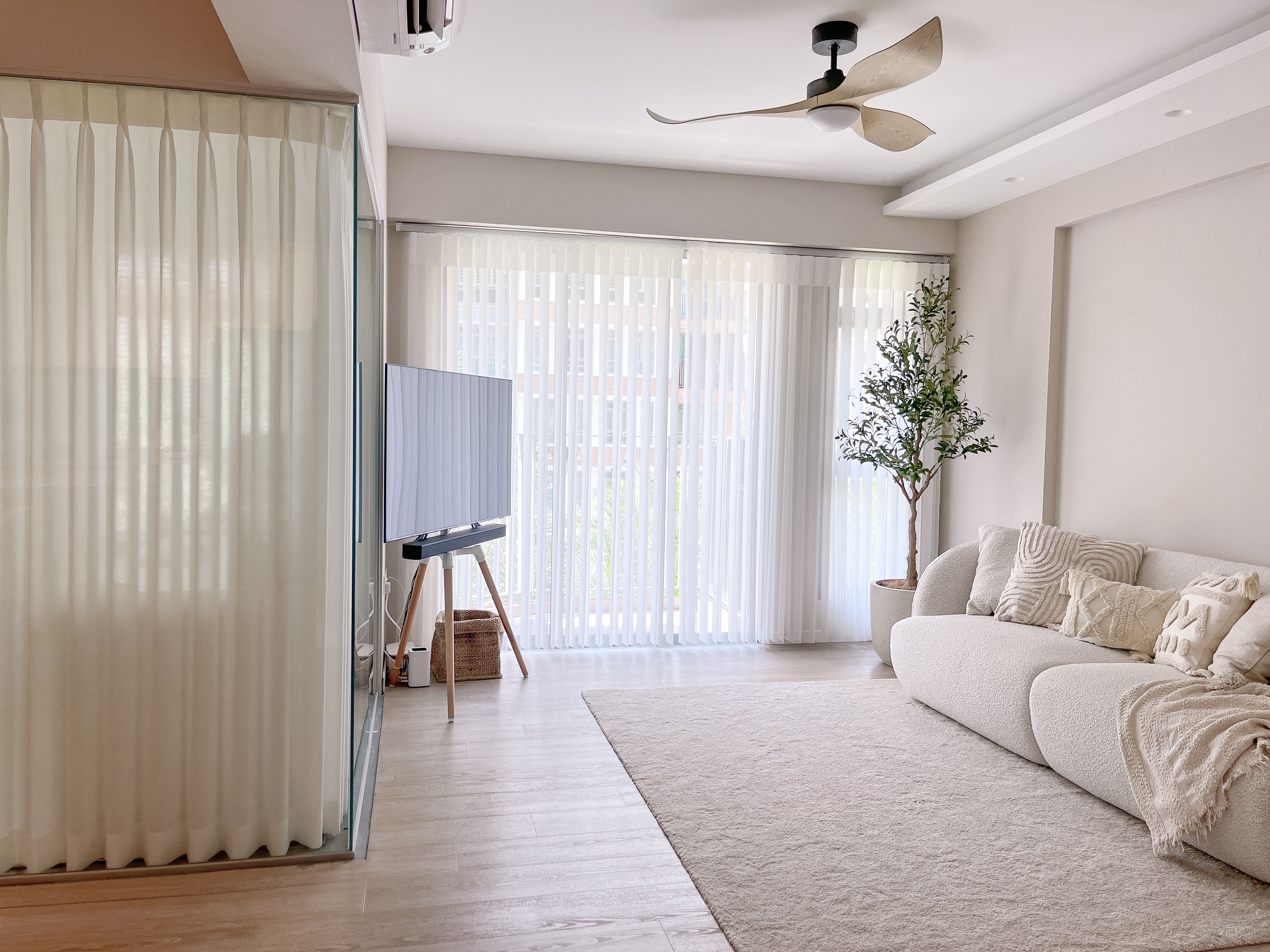 Inside Our Cosy & Airy Scandinavian 4-Room HDB - Modern living room with large window, sheer curtains, minimalist ceiling