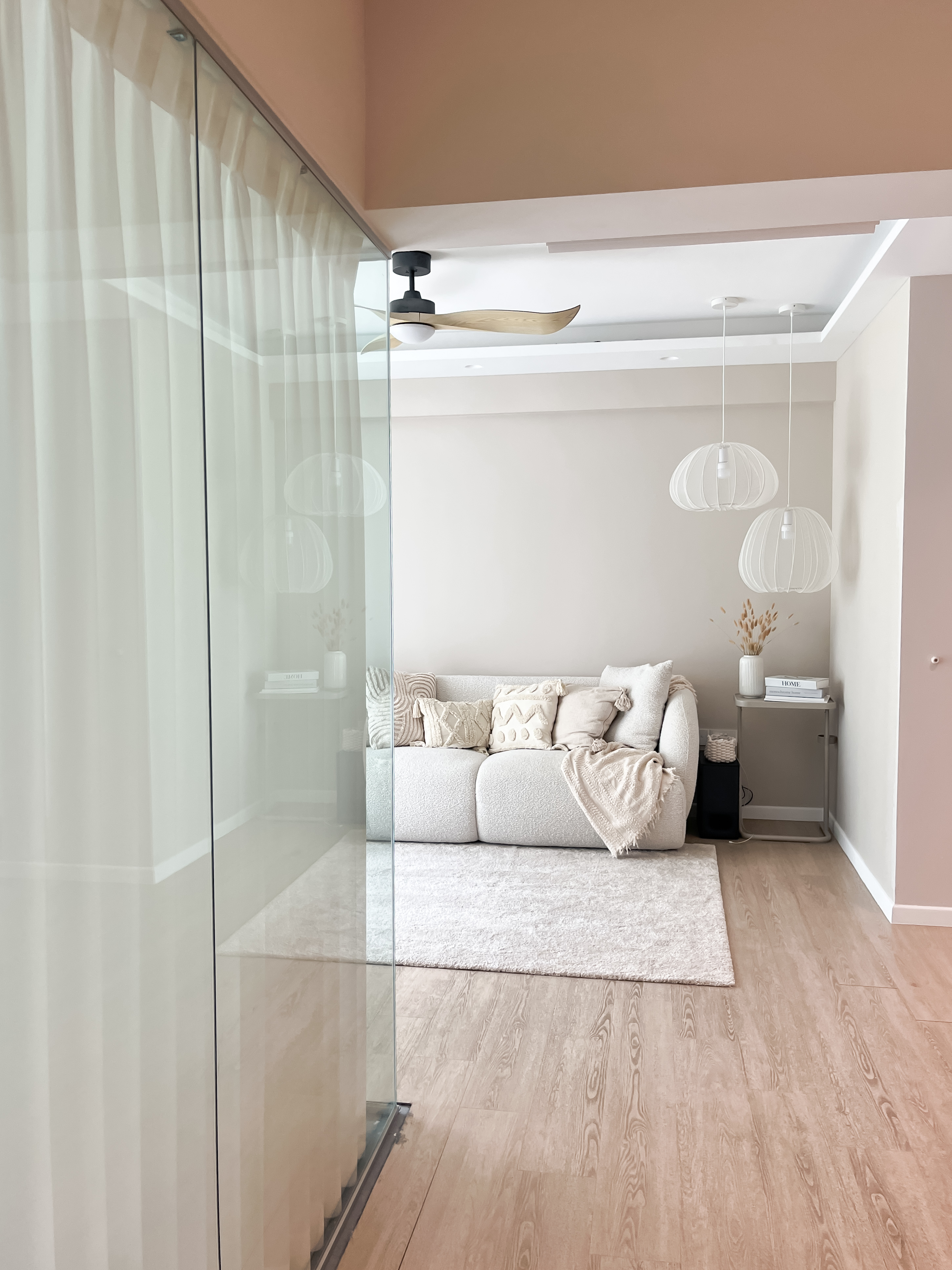 Inside Our Cosy & Airy Scandinavian 4-Room HDB - Glass sliding door, beige curtains, modern ceiling fan, minimalist decor