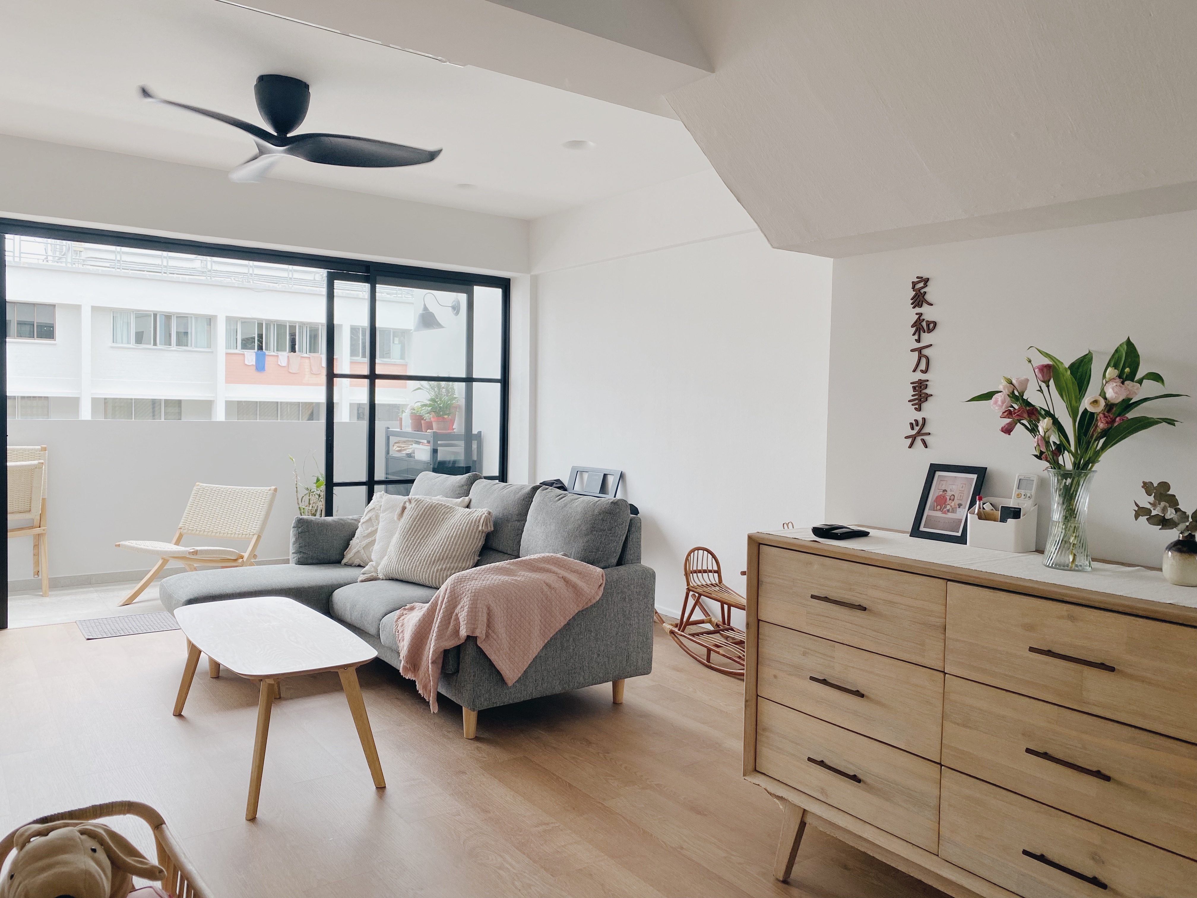 Our Family Friendly Haven: A Modern Farmhouse Living Room - Modern living room with gray sofa, wooden coffee table, and floor