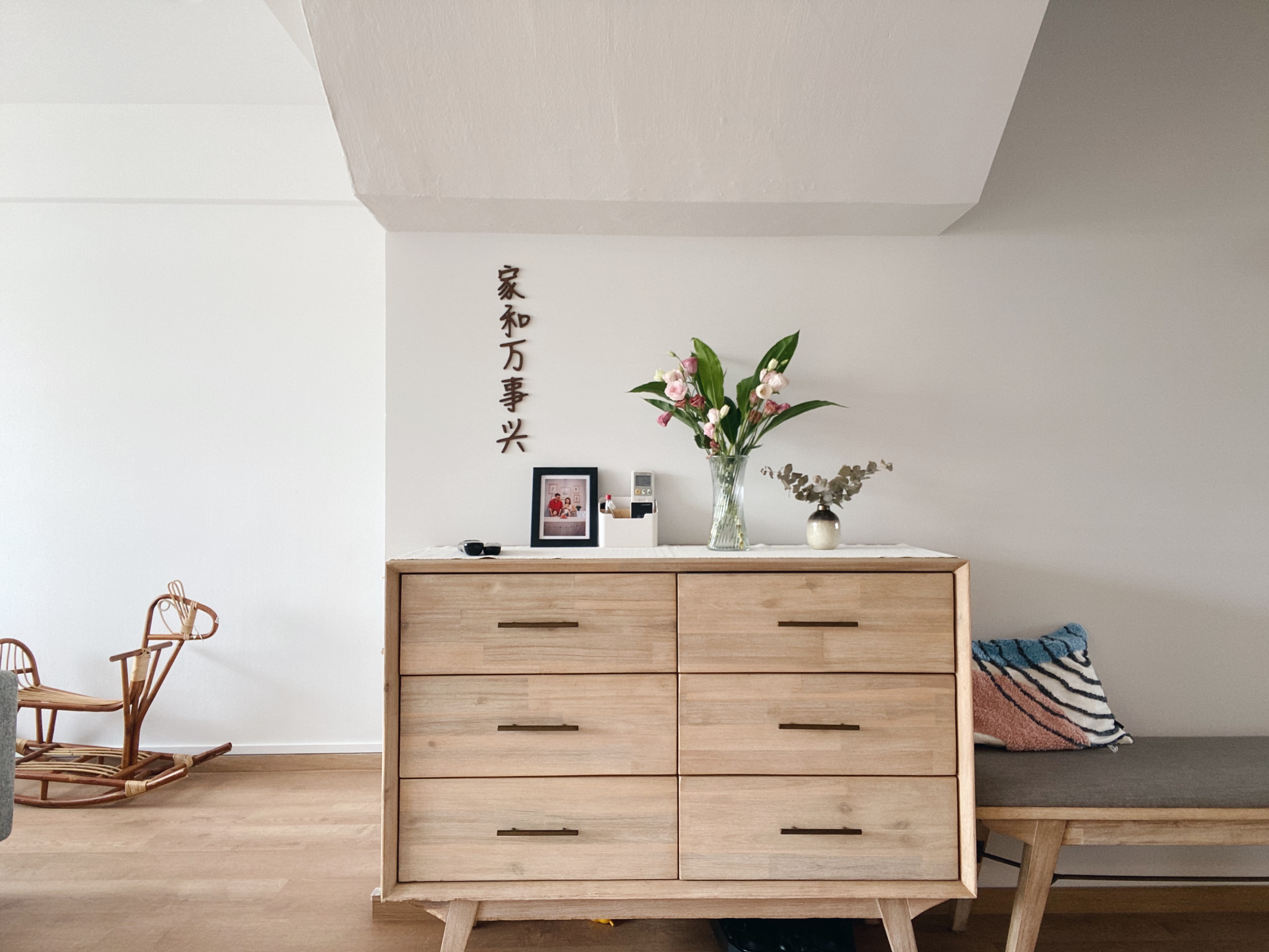 Our Family Friendly Haven: A Modern Farmhouse Living Room - Wooden dresser, minimalist design, light wood finish, six
