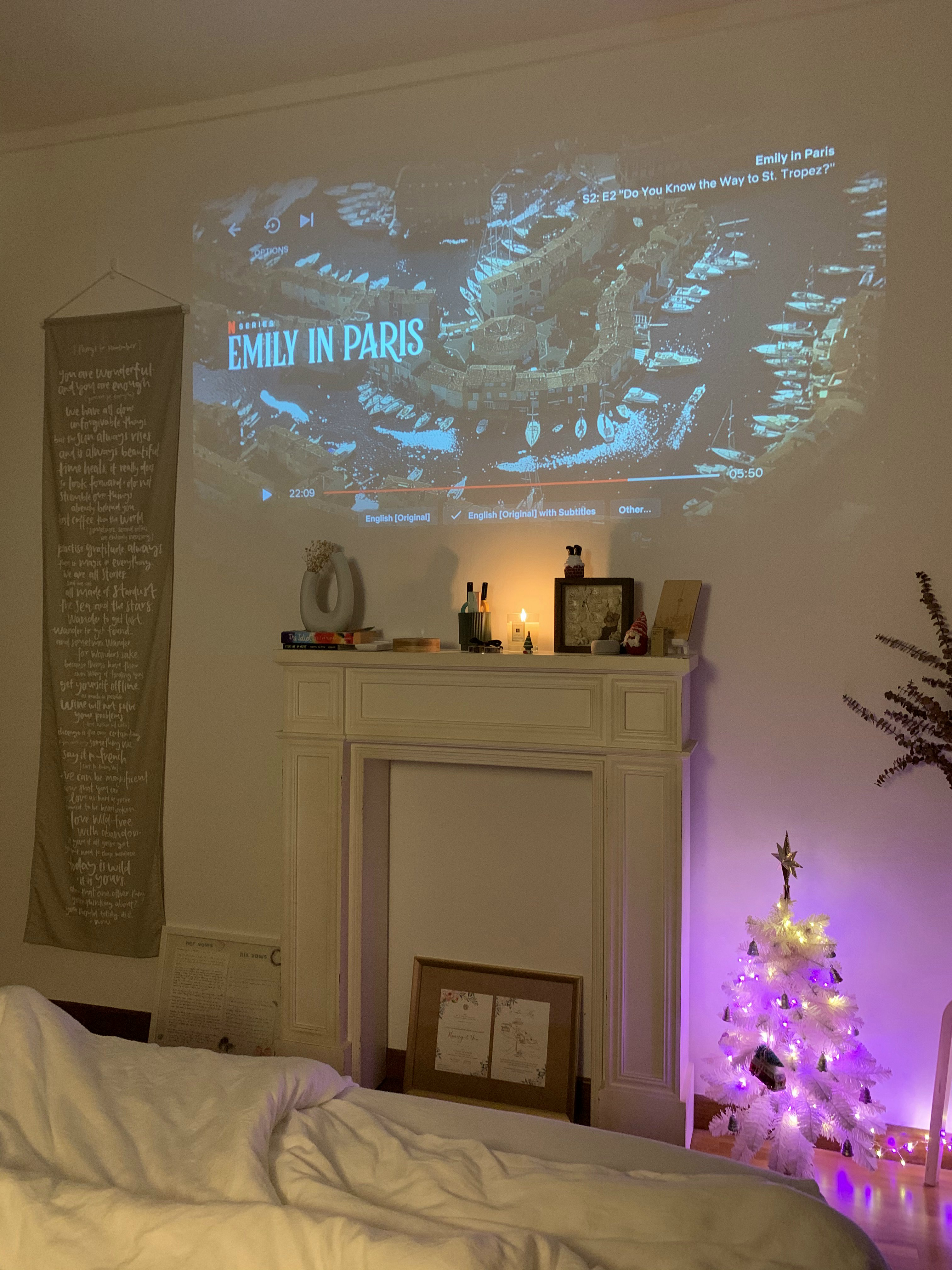 Cozy-Farmhouse-Bedroom-with-Projector-and-Faux-Fireplace