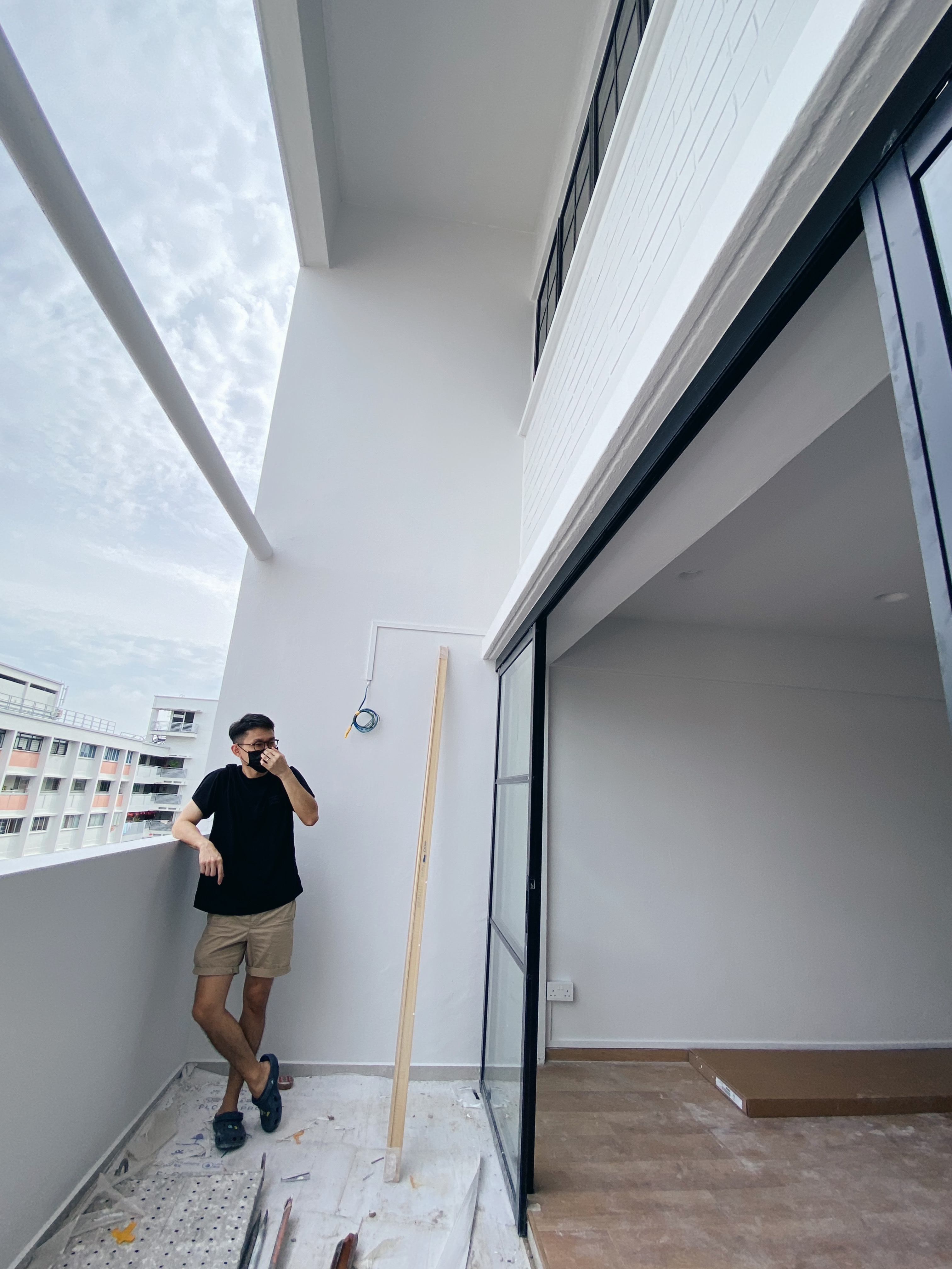 Our Balcony:🪴Little Space, Many Potential!☁️ - Modern apartment exterior, man wearing glasses, black t-shirt, beige shorts
