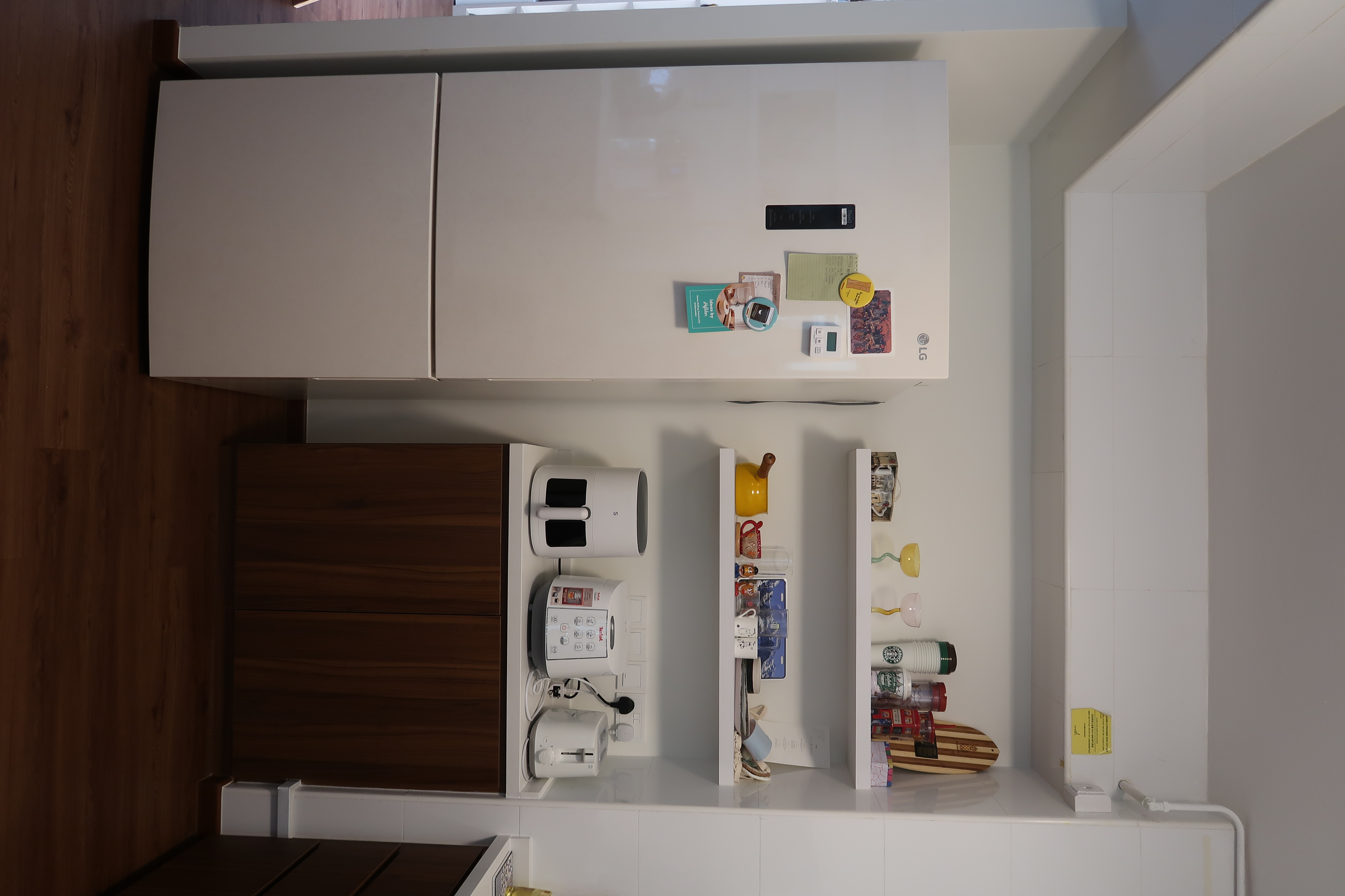 Our open concept kitchen with an island as centrepiece :) - White kitchen appliances, wooden cabinets, white refrigerator