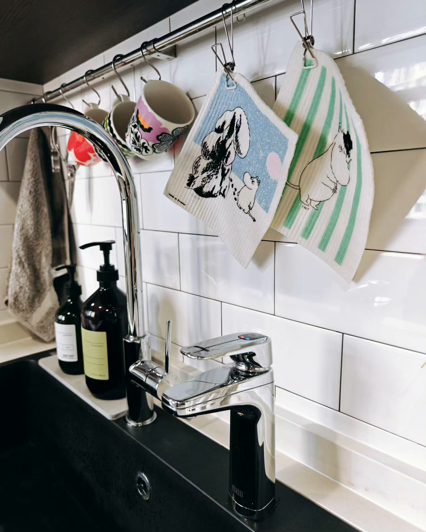 Achieving Our Kitchen Goals Despite A Little Hiccup! - silver faucet, white tiled wall, black countertop, hanging mugs