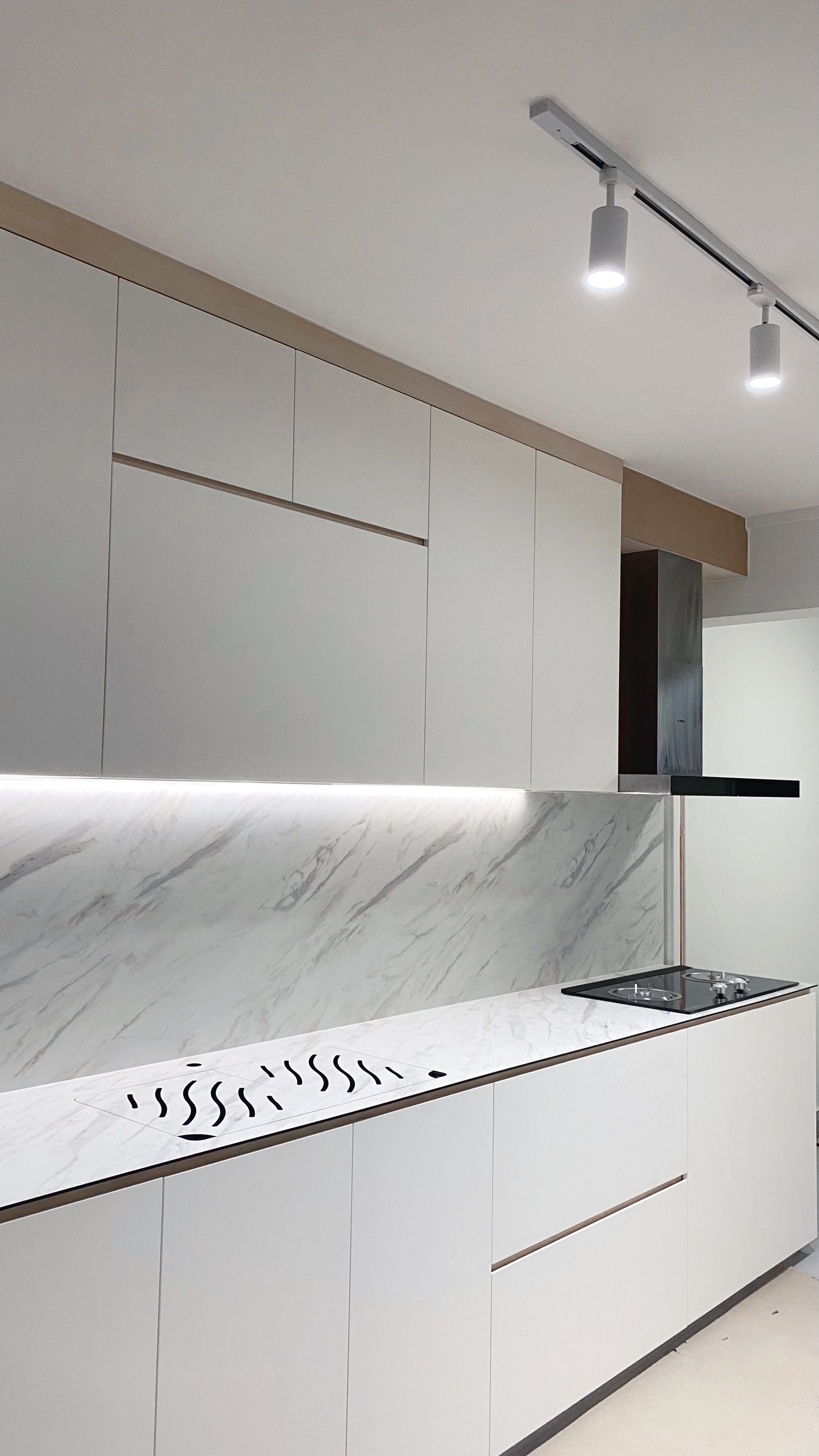 MasterChef Singapore: The Tofu Edition! - White modern kitchen cabinetry, marble backsplash, sleek stainless steel stove