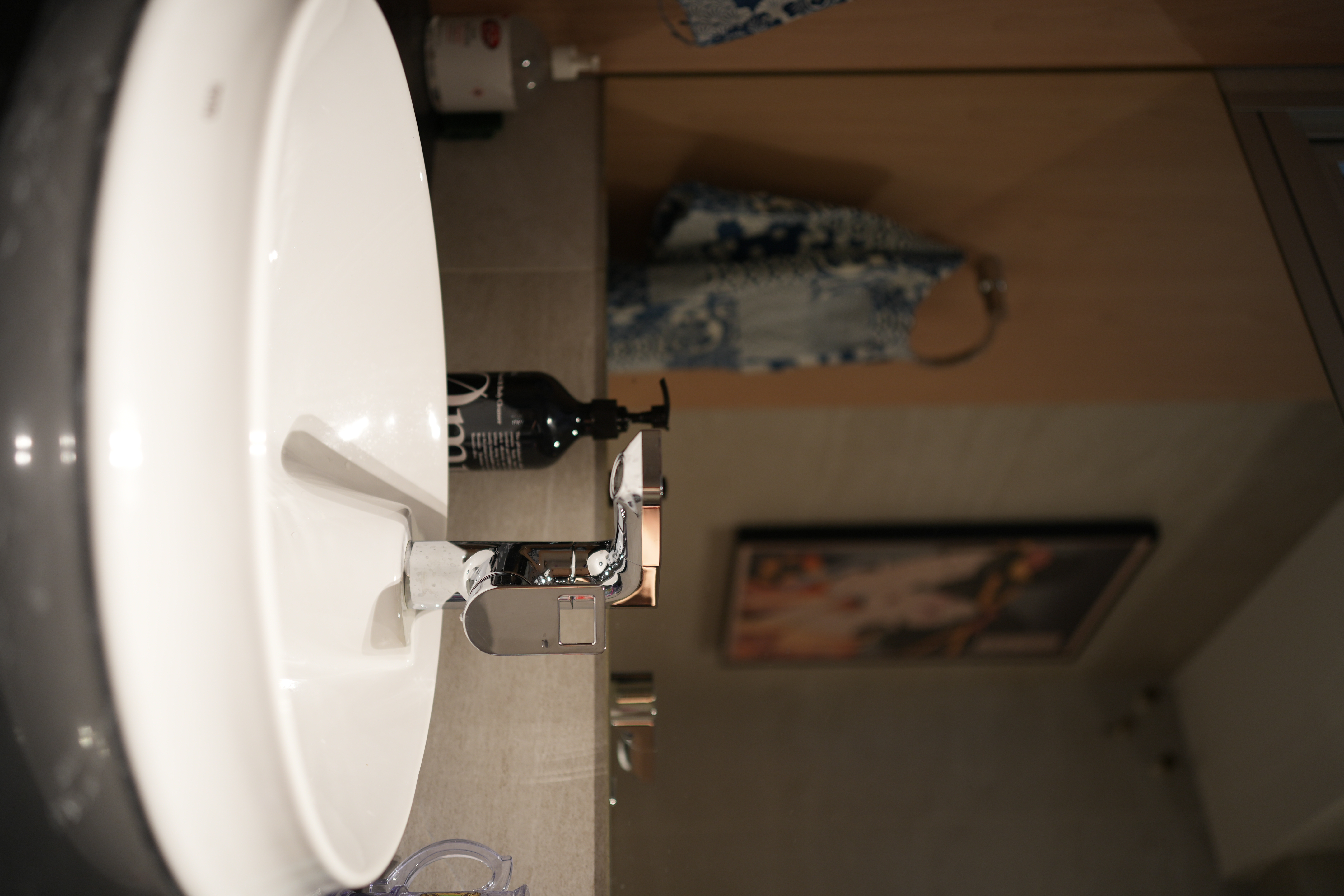 Our Bathroom: Dual Showers, Onsen Style Sit-Downs & A Powder Room - White bathroom sink, modern design, sleek faucet, mirror