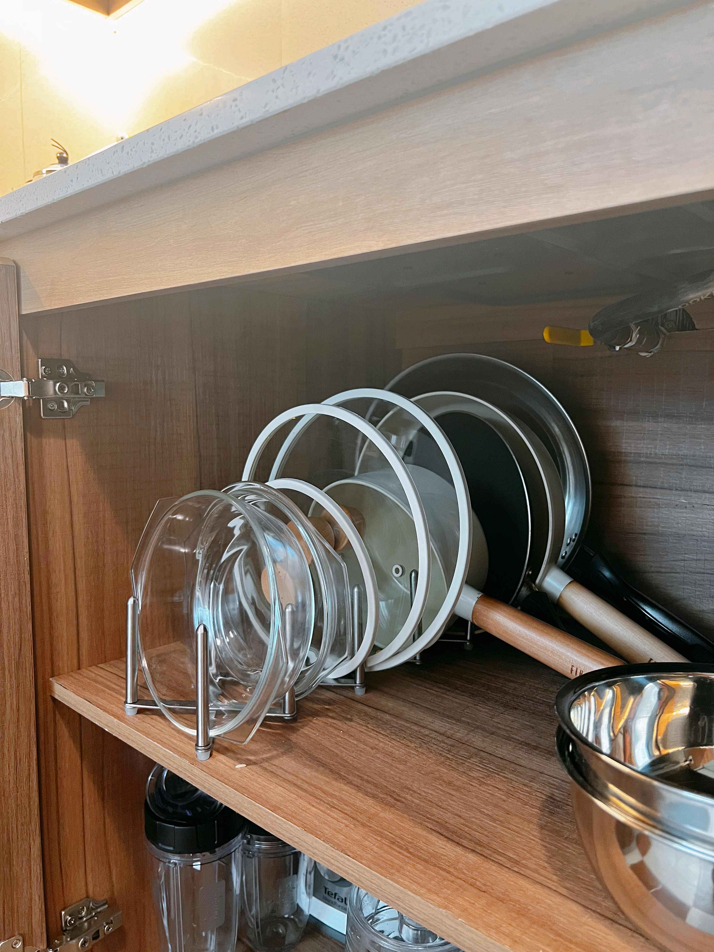 Crafting Our Open-Closed Culinary Station: The Kitchen - Wooden kitchen cabinet, glass bowls, stainless steel utensils