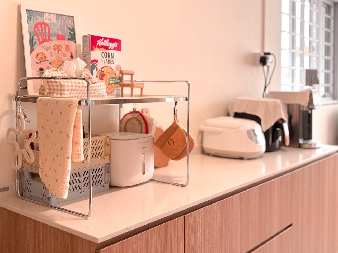 Our Favourite Part - The Kitchen! - Cereal box, kitchen counter, utensils, towels, rice cooker, toaster, electric kettle