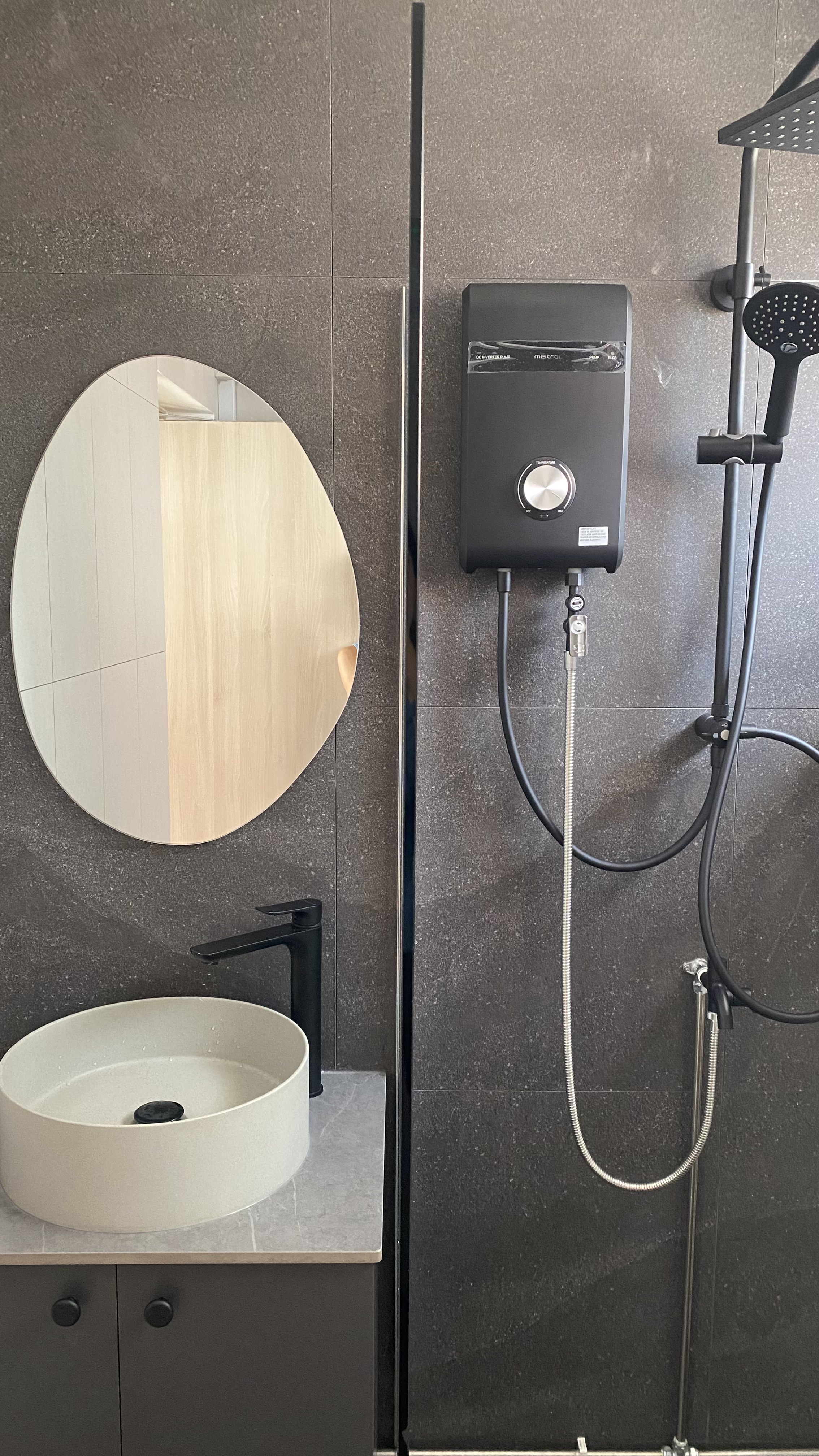 The tofus' bathrooms with hidden surprises 🕳️ - modern bathroom vanity, sleek sink, circular mirror, black faucet, gray