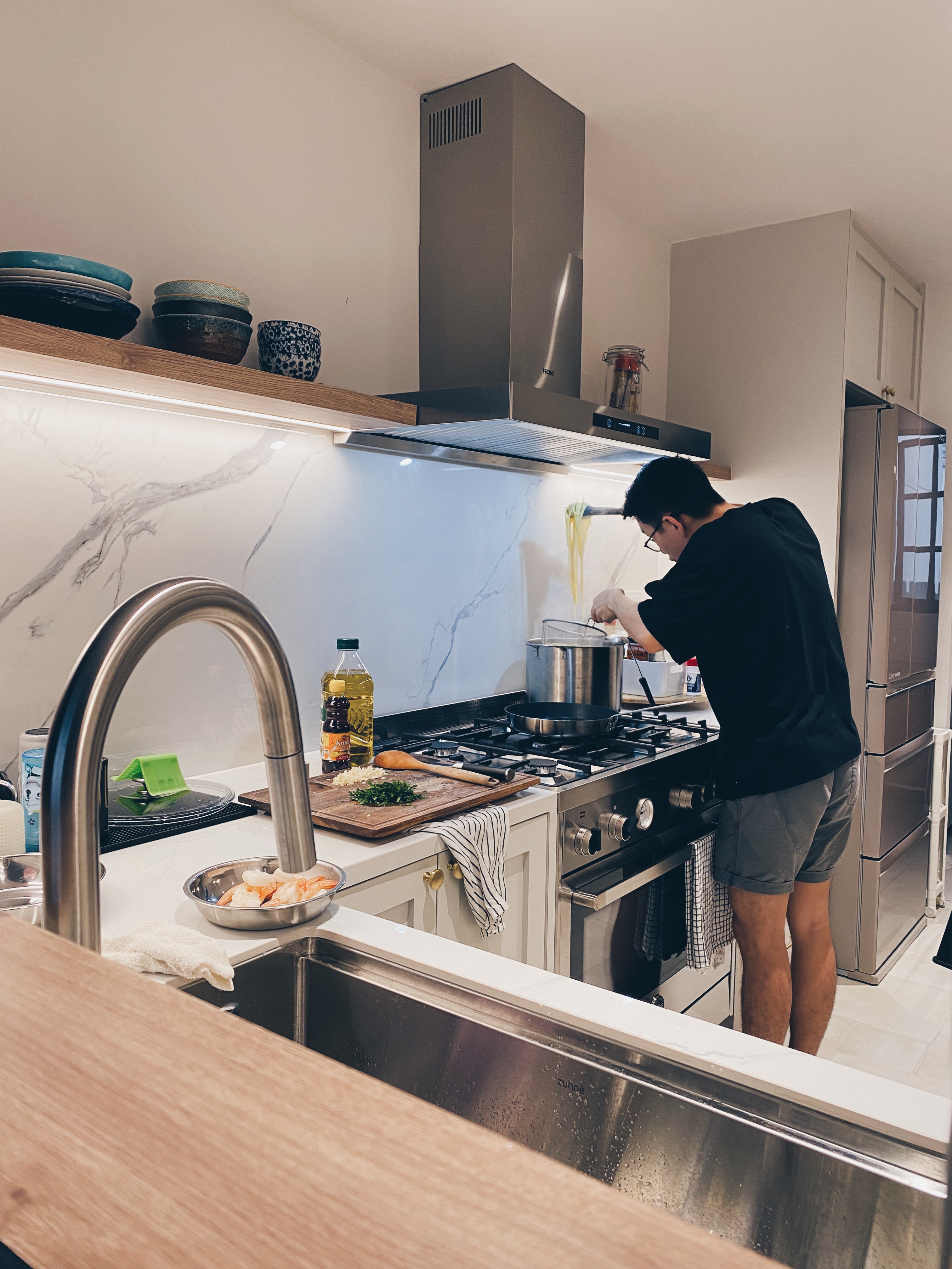 I love a white kitchen, it’s ruining my life, UNTIL ... - modern kitchen, stainless steel appliances, man cooking, wooden