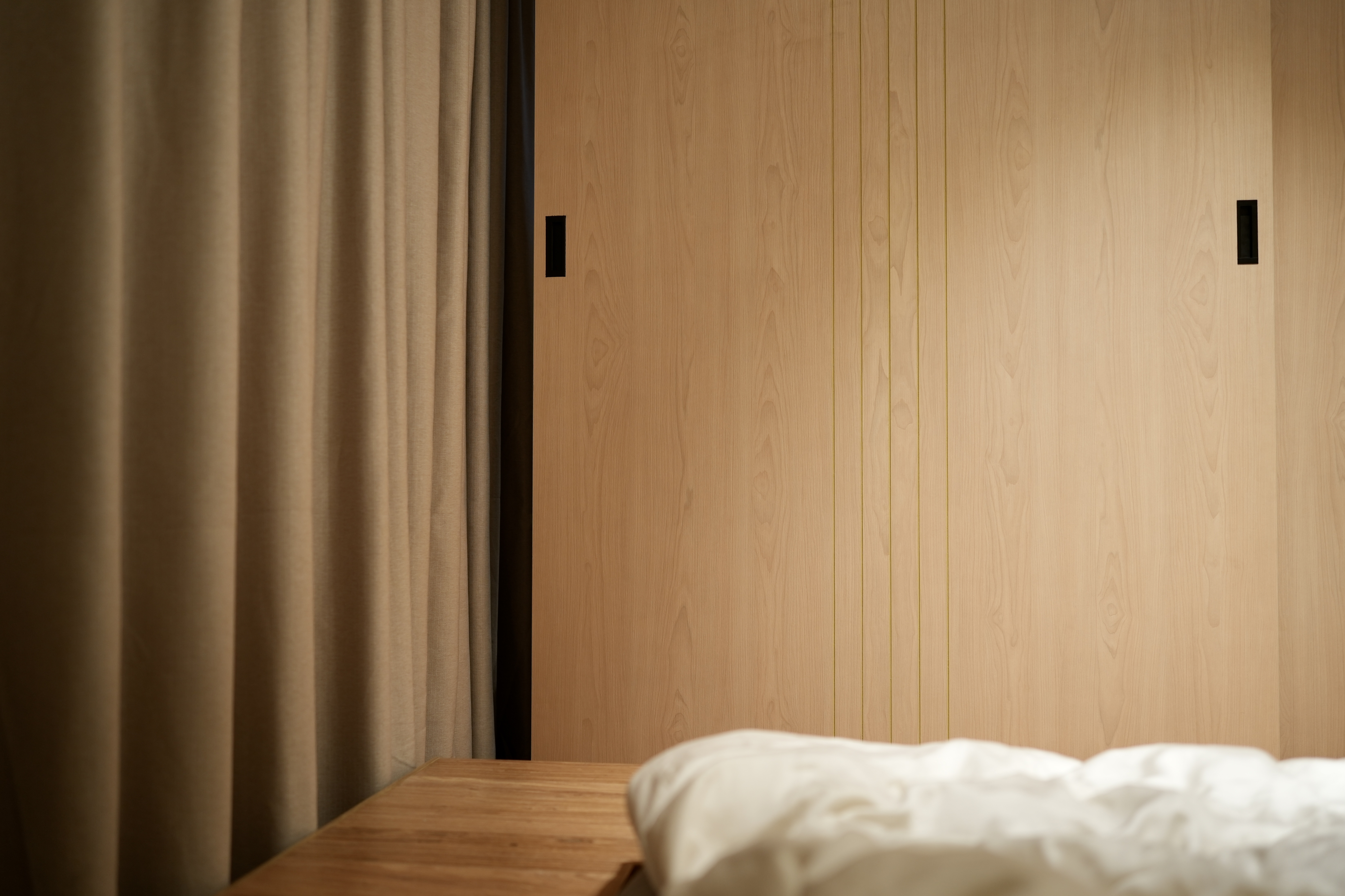 An Essential Study in 4m² - Wooden wall, minimalist design, natural wood texture, light brown tones, vertical paneling, soft