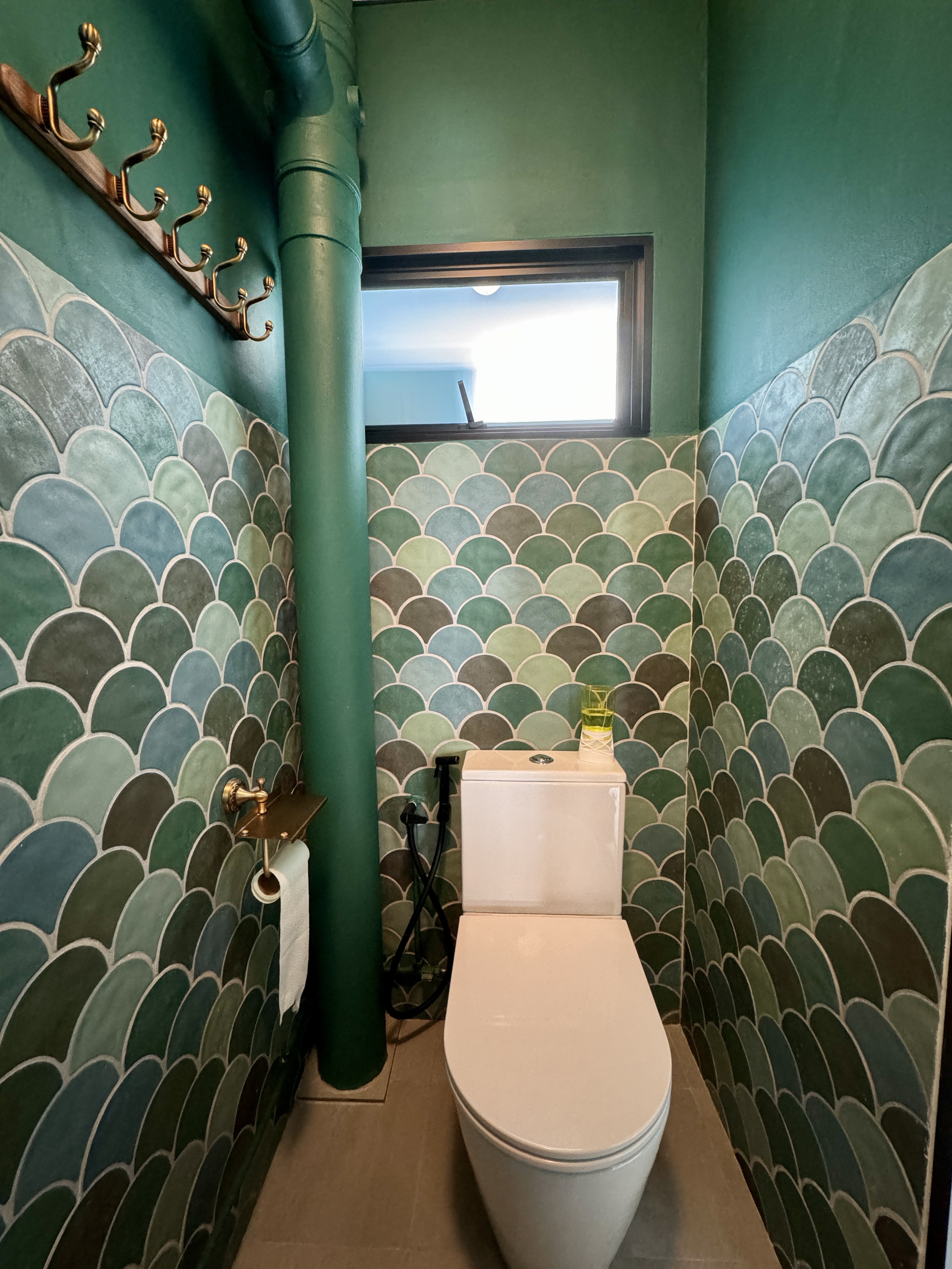 The Mermaid's Castle (Bathroom 1/3) - Majestic green and blue mosaic tiles, elegant gold fixtures, modern toilet, white