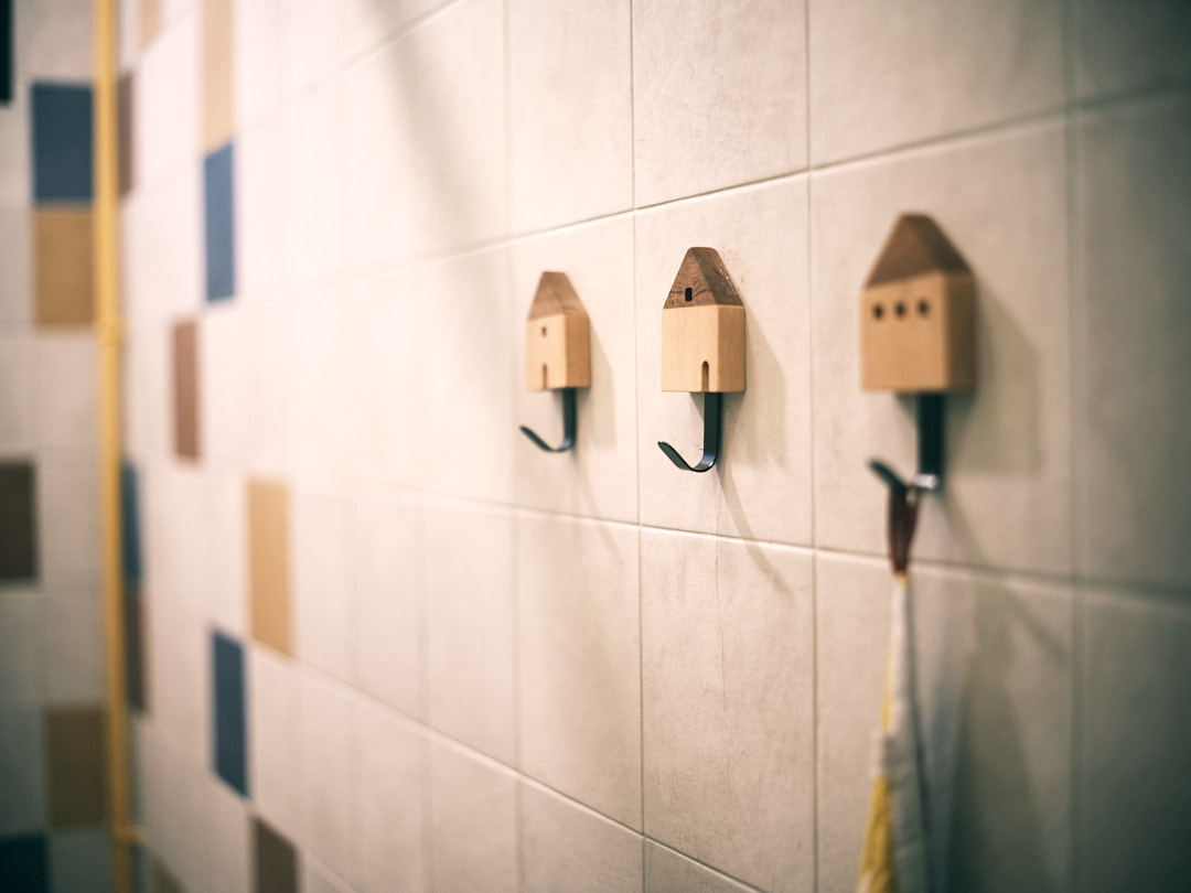 The Cheerful Swimming Pool (Bathroom 3/3) - Wooden soap dish, beige tiled wall, abstract pattern, geometric tiles, modern