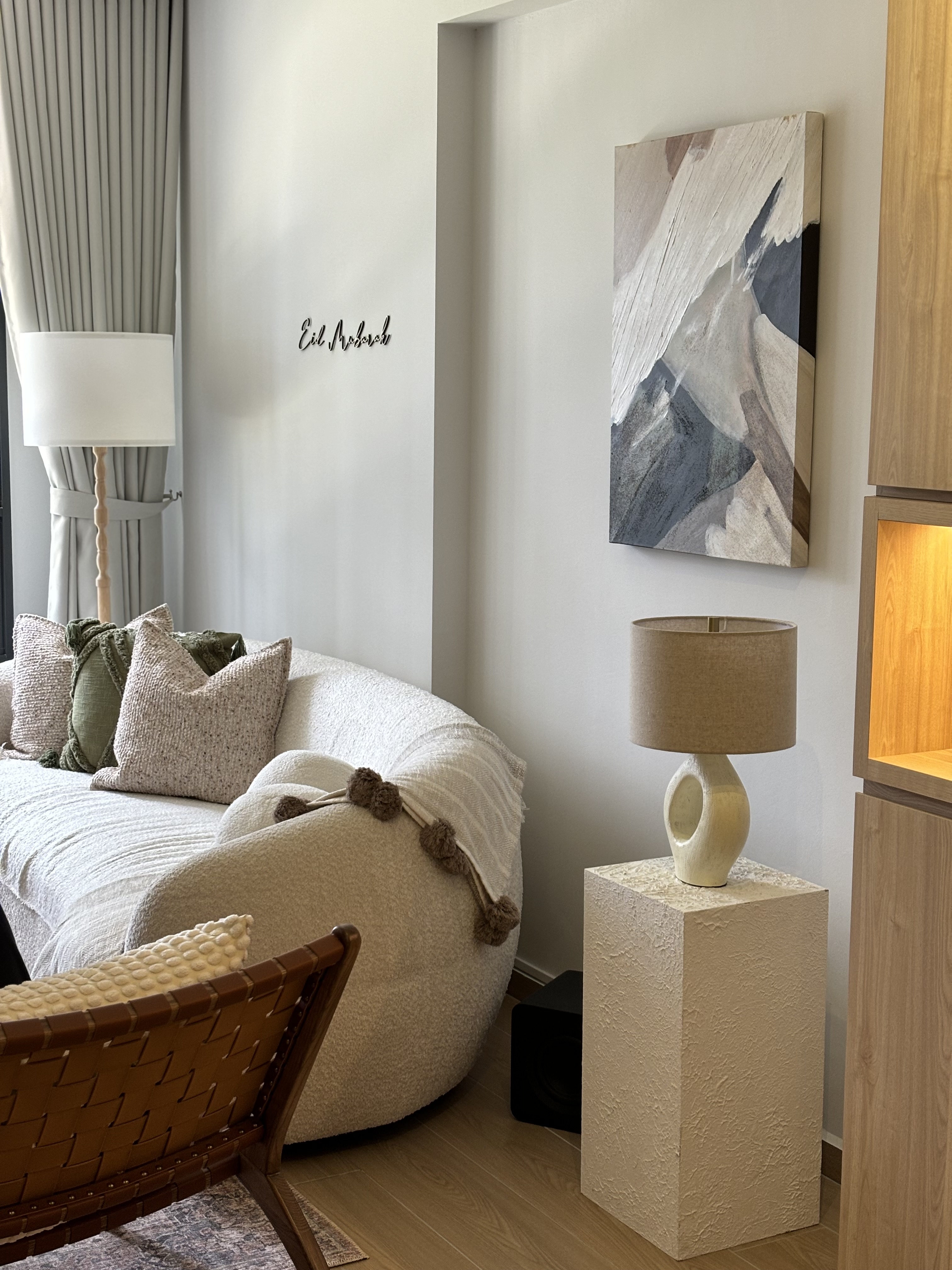 Our Simple & Cosy Living Room - Modern minimalist living room, cozy sofa, textured cushions, abstract painting, soft beige