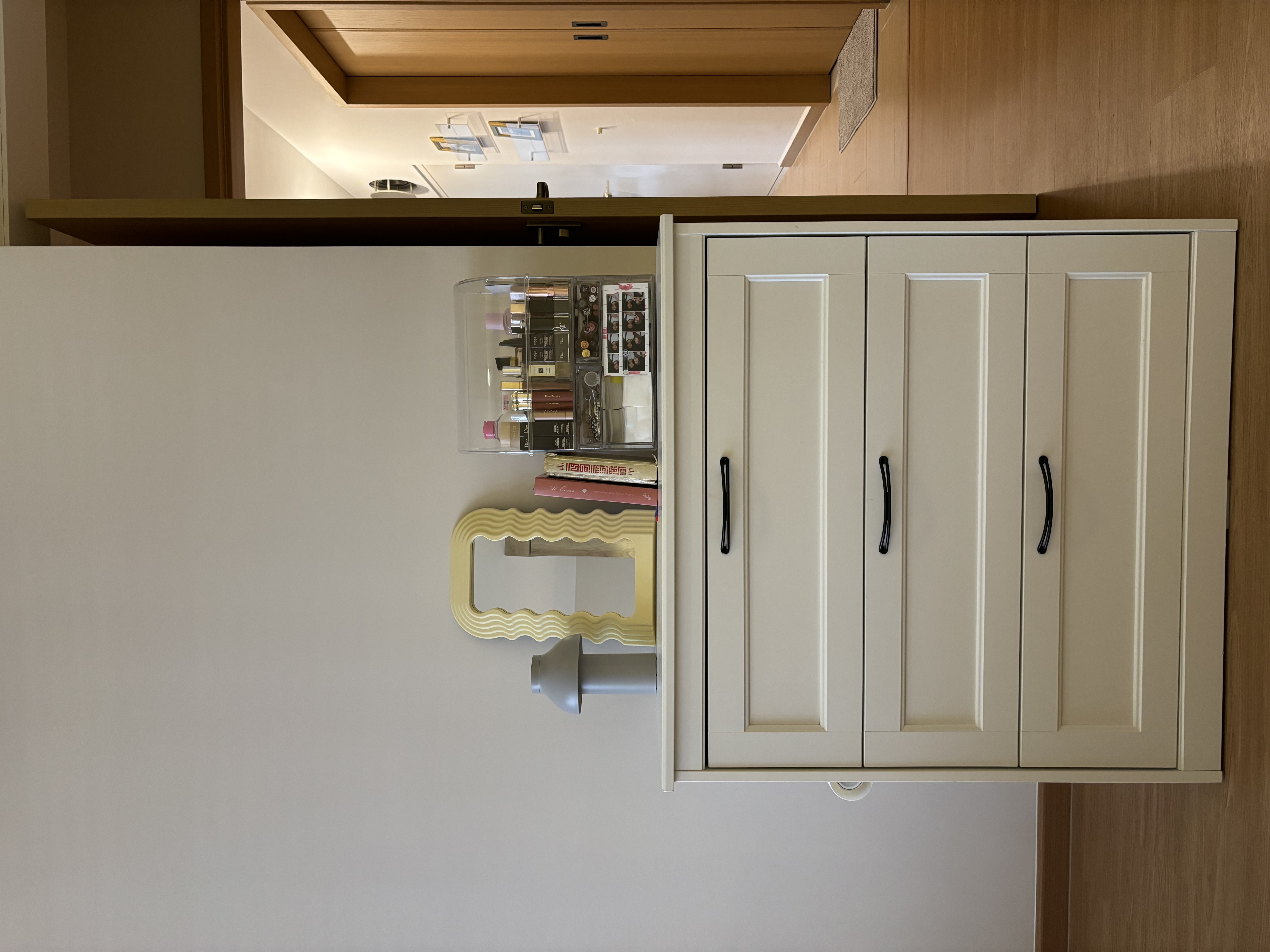 A peek inside our Master Bedroom - Wooden cabinet, beige color, open shelf, neatly organized, makeup items, books, decorative