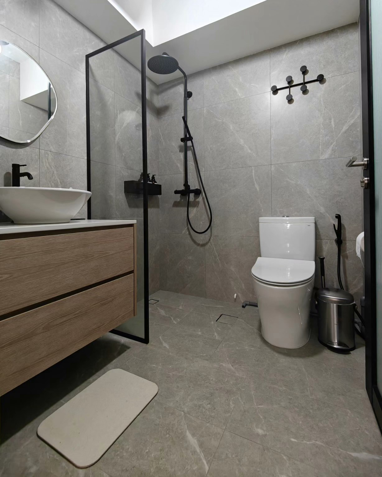 "Oh You Have 3 Bathrooms?!" - Grey marble tiles, modern design, sleek sink, wooden vanity, black faucet, glass shower