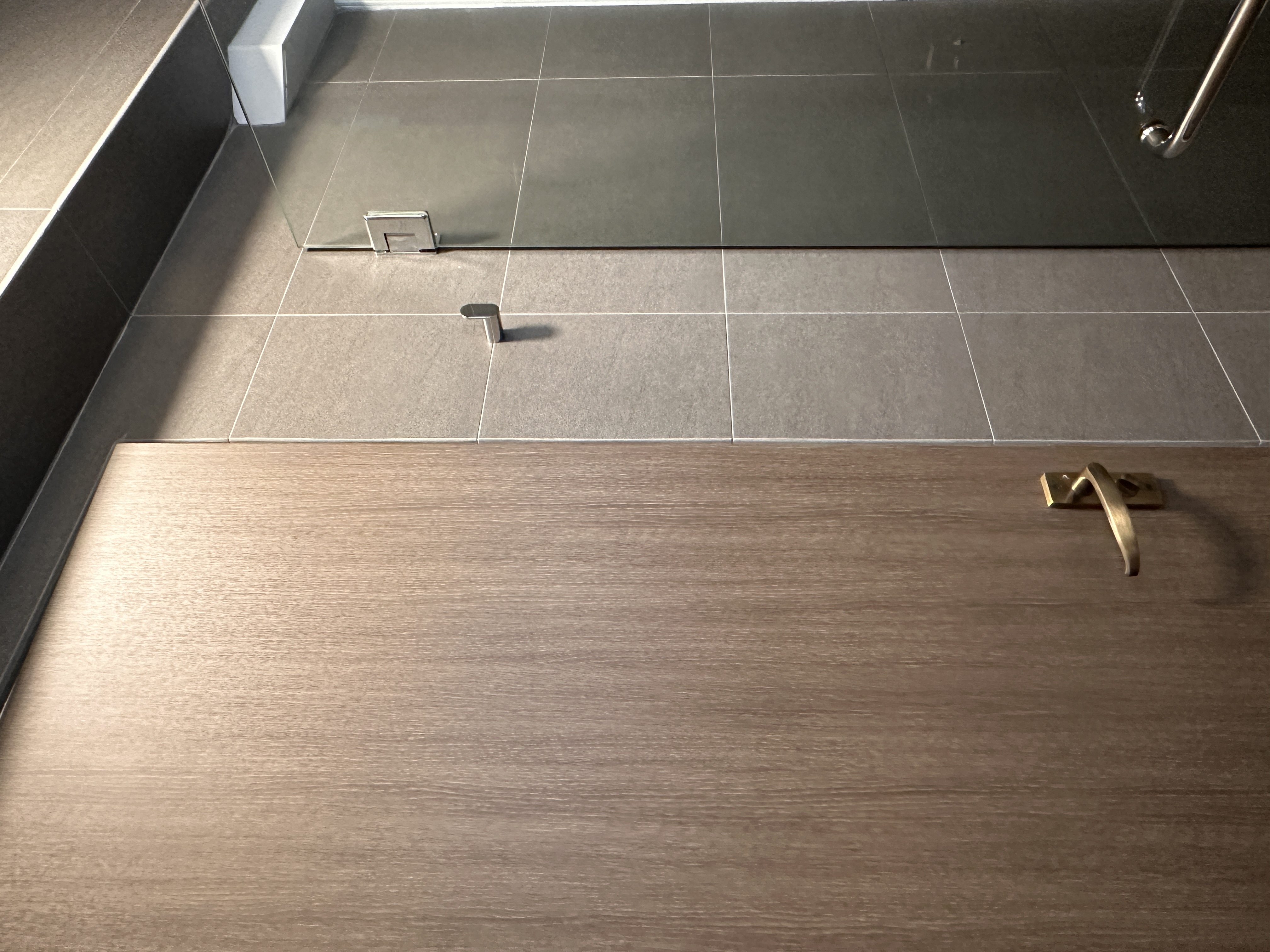 Our toilets - minimal yet functional, just the way we love! - Modern bathroom floor tiles, sleek dark gray tiles, minimalist