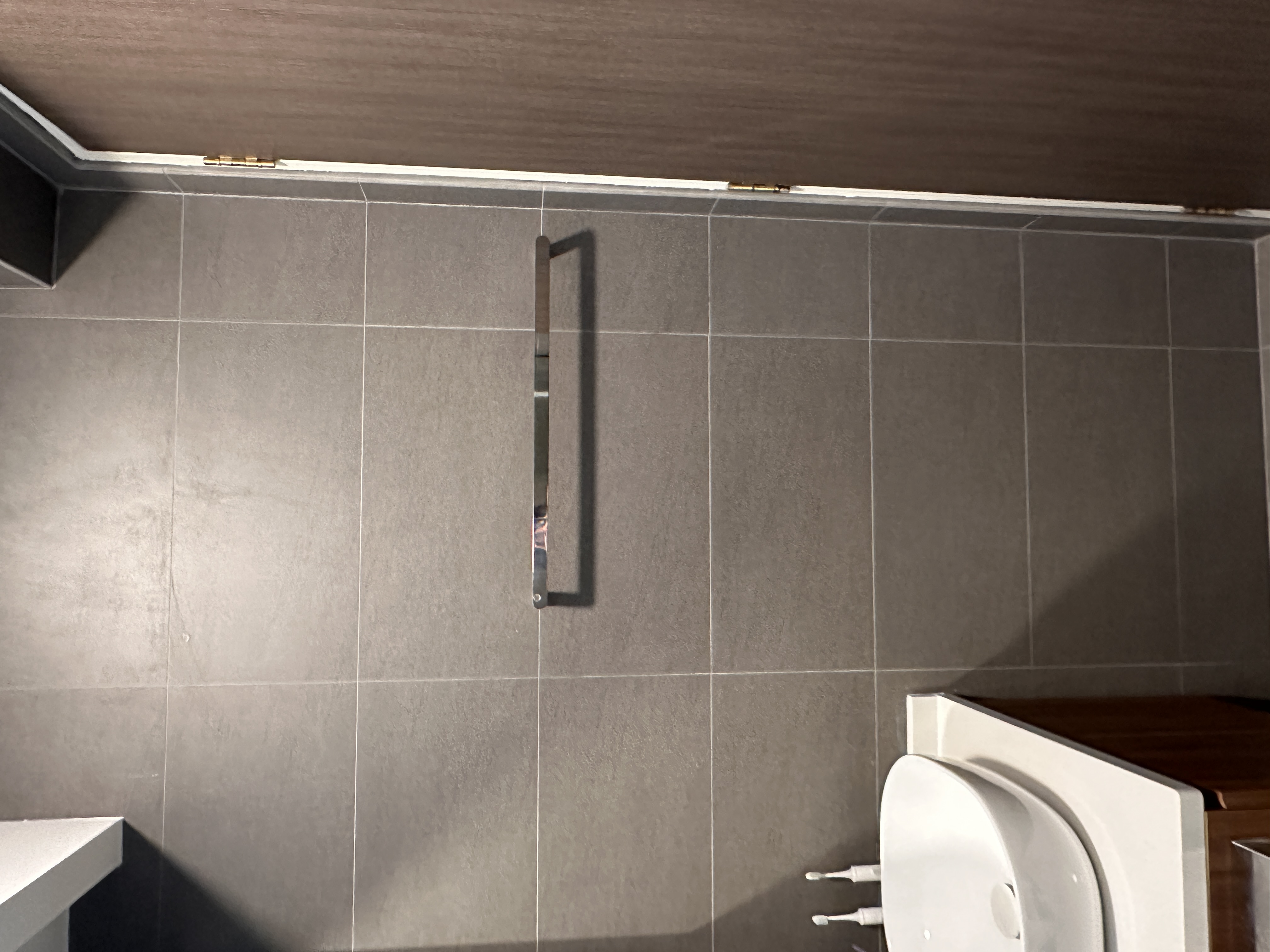 Our toilets - minimal yet functional, just the way we love! - modern bathroom, tiled floor, gray tiles, wall-mounted fixture