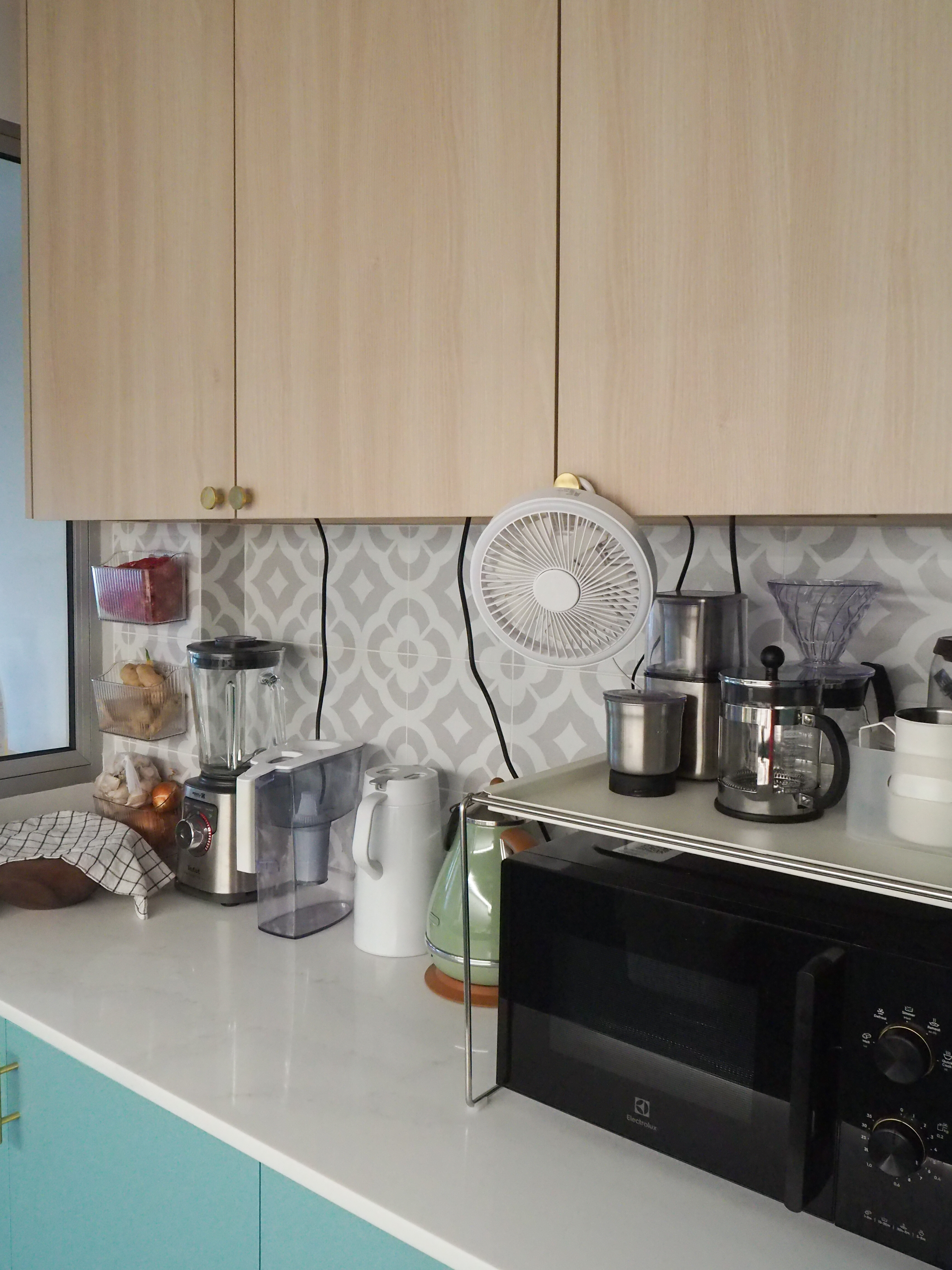 Our Galley Kitchen: 5 best reno decisions  - Light wooden kitchen cabinets, modern appliances, white countertop, teal