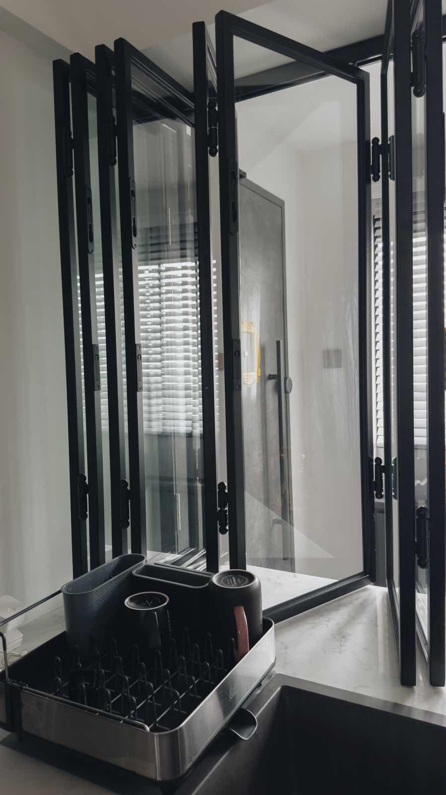 Kitchen Alchemy: The Magic of My Open-Closed Concept Kitchen - black kitchen cabinetry, modern design, sleek black frames