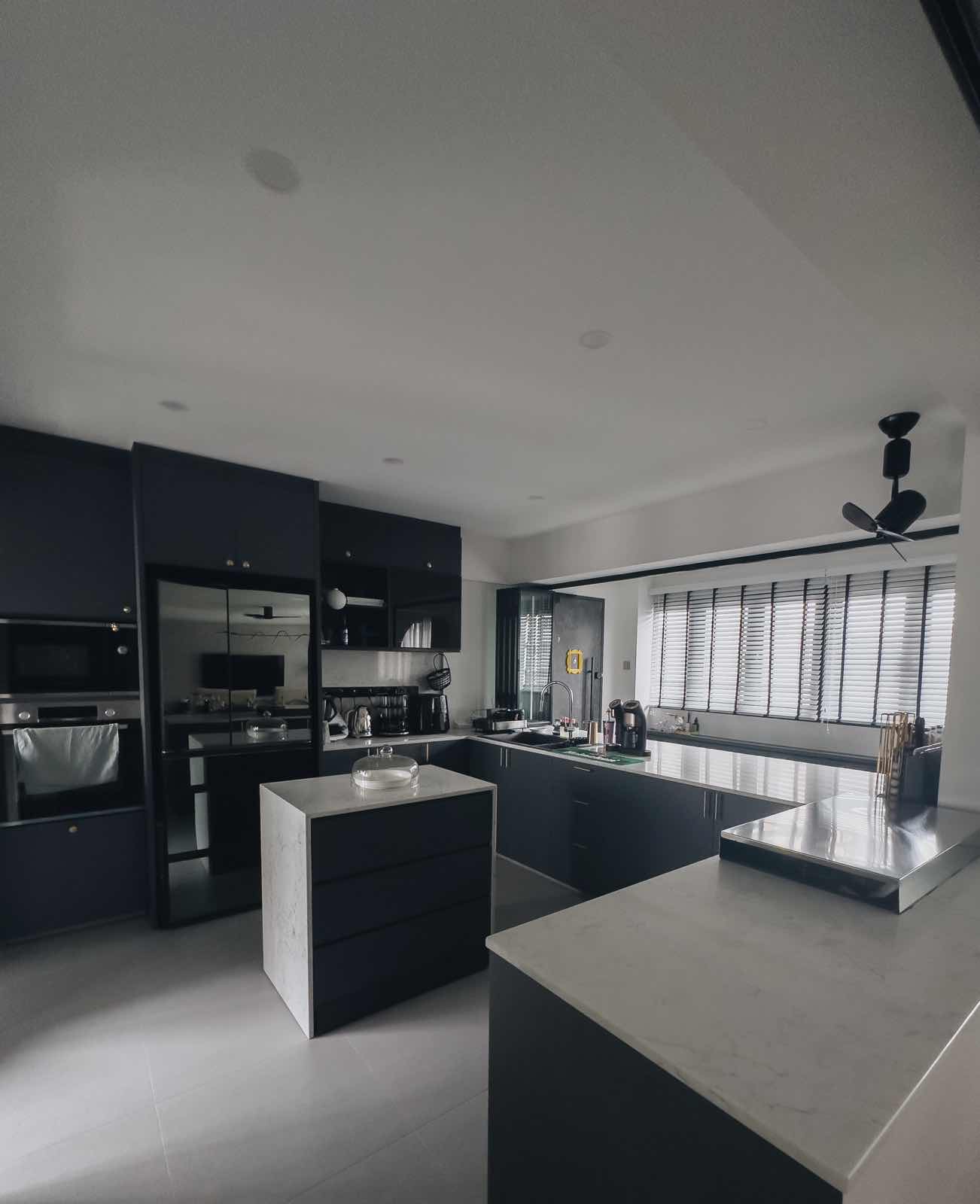 Kitchen Alchemy: The Magic of My Open-Closed Concept Kitchen - Modern kitchen with sleek black cabinetry, stainless steel