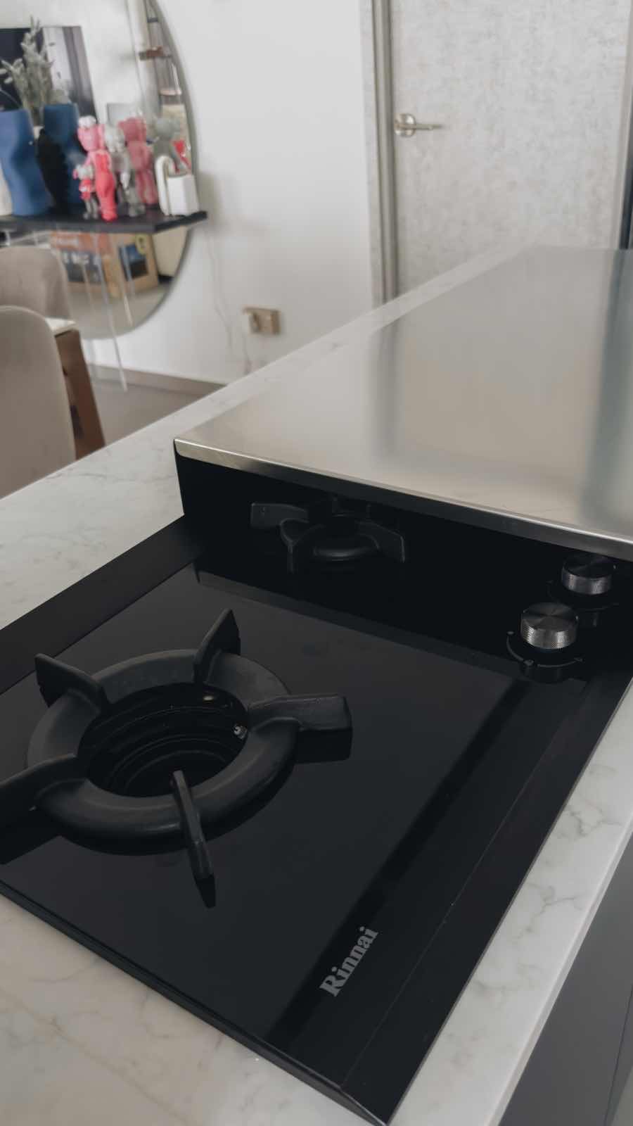 Kitchen Alchemy: The Magic of My Open-Closed Concept Kitchen - Modern kitchen countertop, sleek black stove, minimalist
