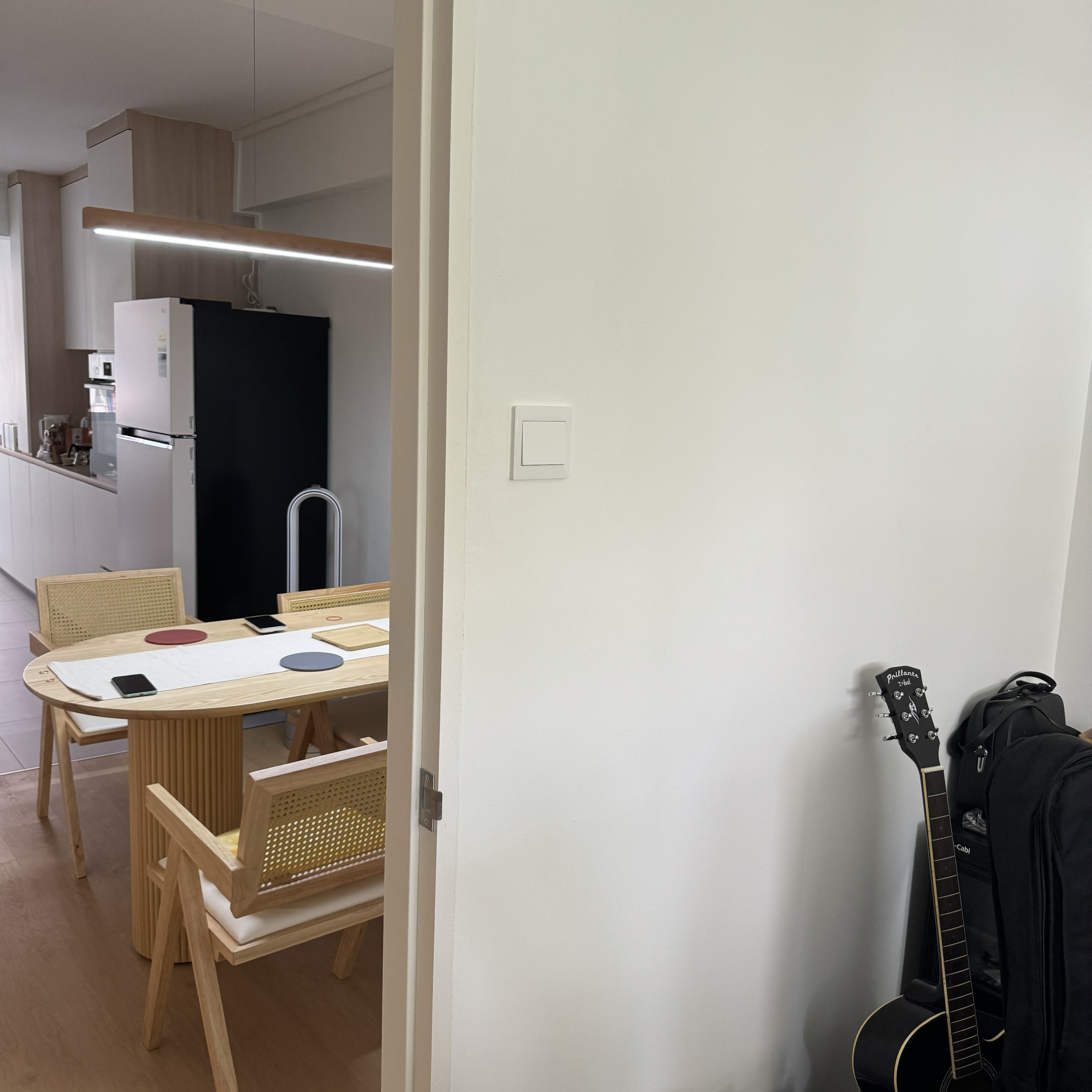 A tiny study room for the tiny tofus  - Modern kitchen with sleek appliances, wooden dining table with chairs, red, blue, and