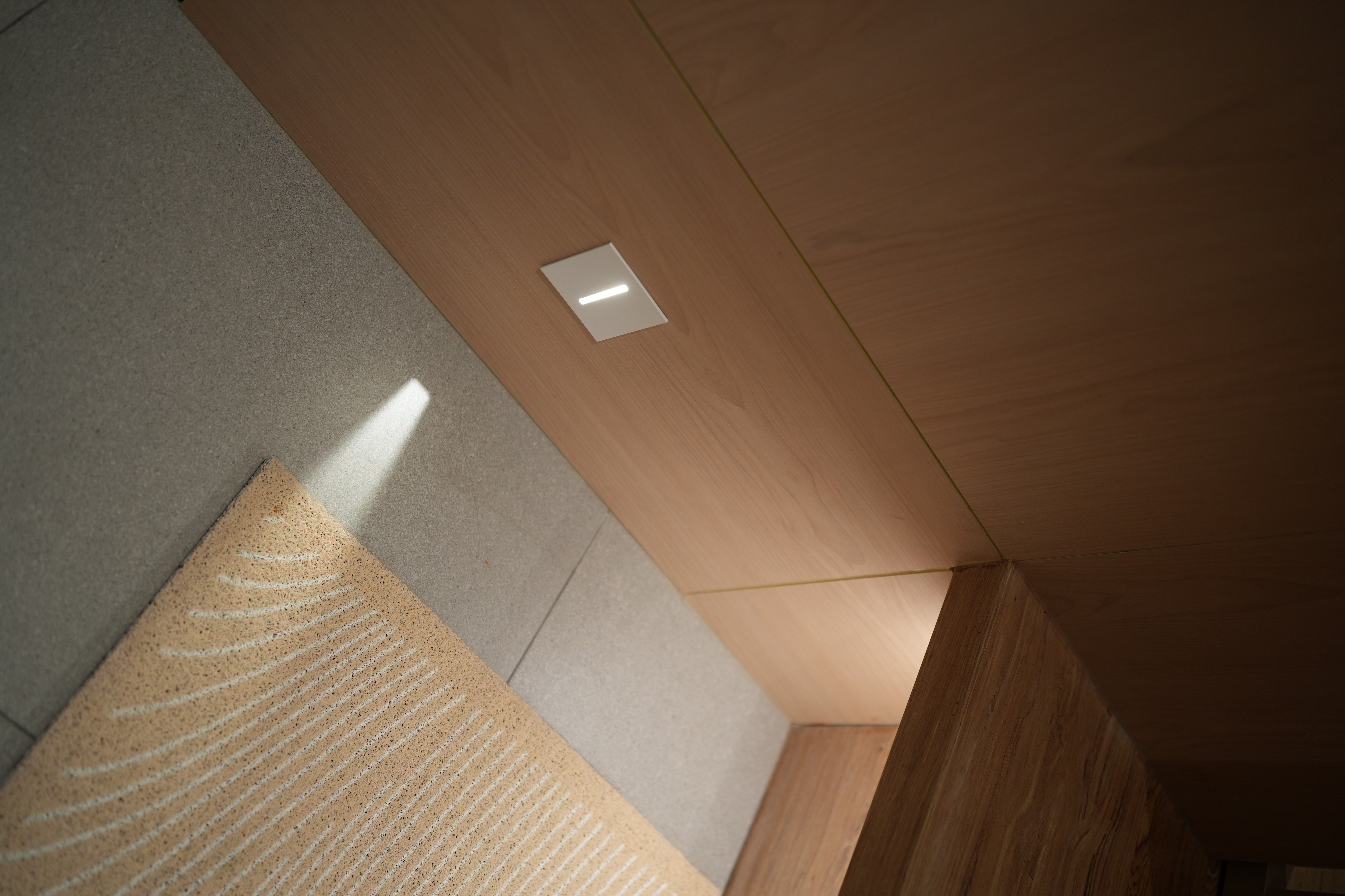 Choosing Lighting: Dimmables, Accents, Moods - Wooden floor, carpet, light fixture, shadow, geometric pattern, beige carpet